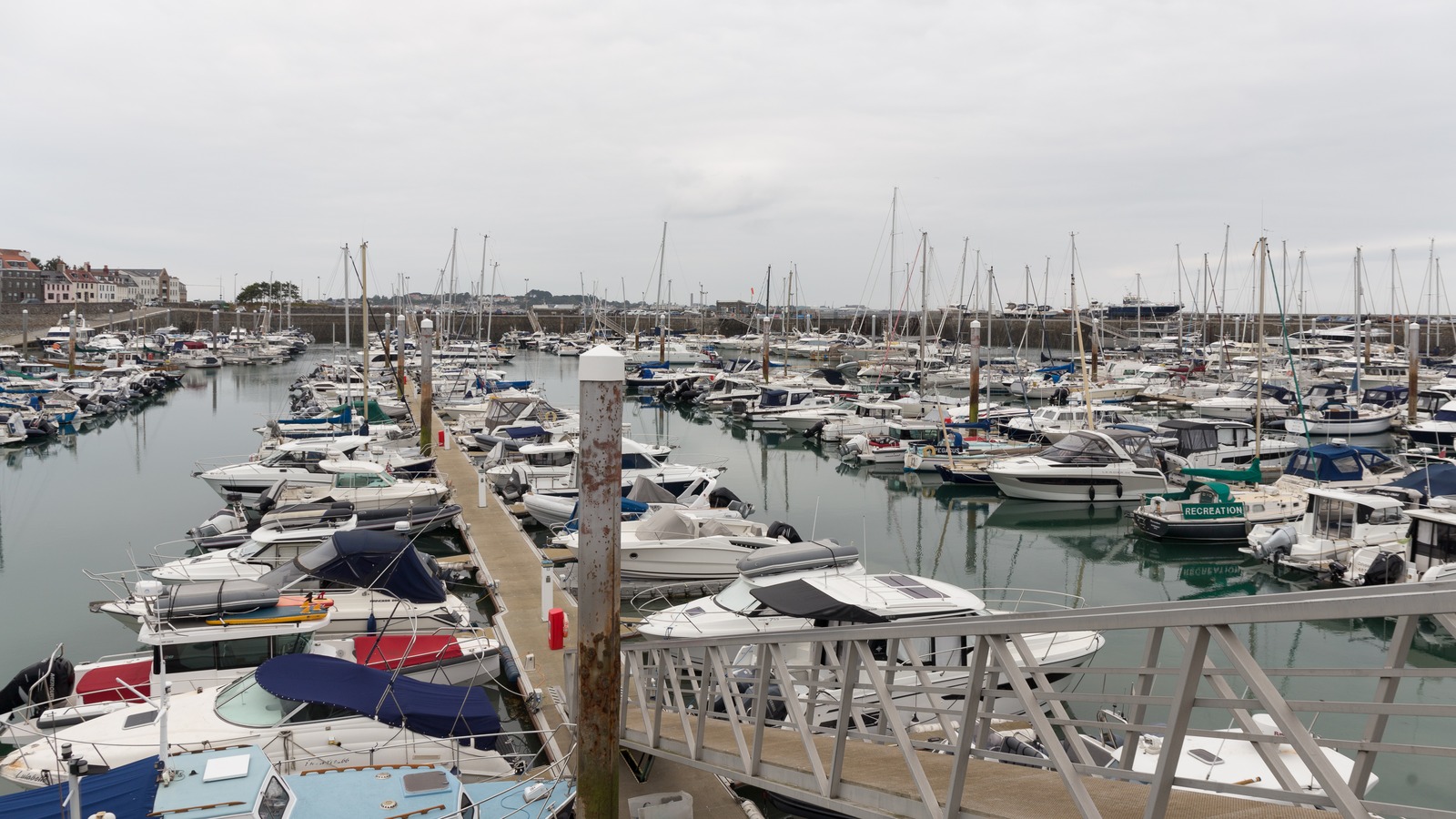 Boats beside St Julian's Pier in St Peter Port Harbour in August 2025, a contextual Guernsey view