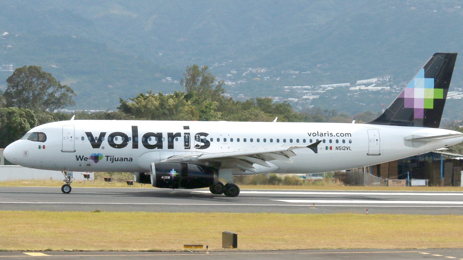 Volaris Airbus A320 in We Love Tijuana special livery on a runway