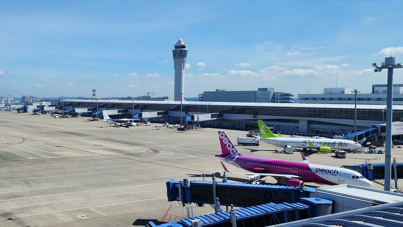 Terminal 1 apron and control tower at Chubu Centrair International Airport in July 2024