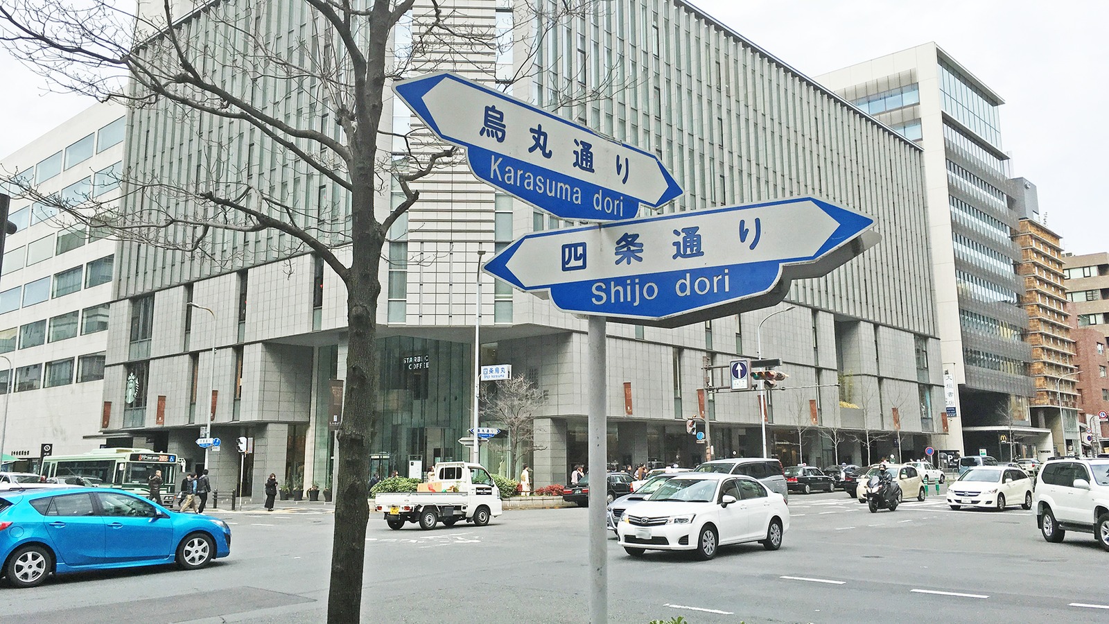Street signs for Karasuma dori and Shijo dori at the Shijo-Karasuma intersection in Kyoto