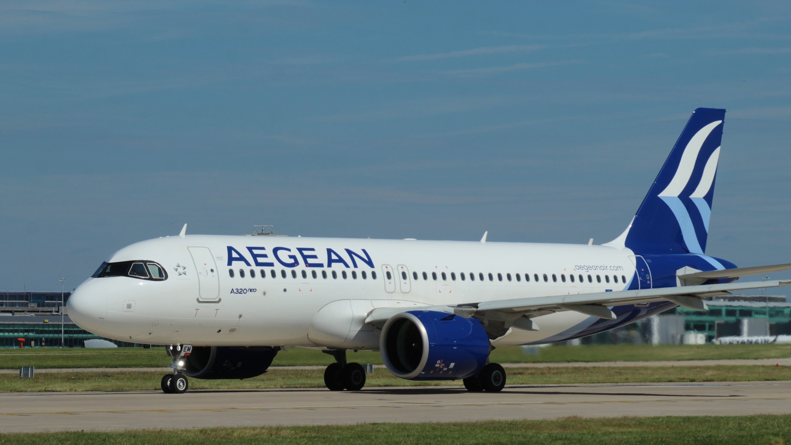 Aegean Airlines Airbus A320neo SX-NEM on a taxiway under a blue sky
