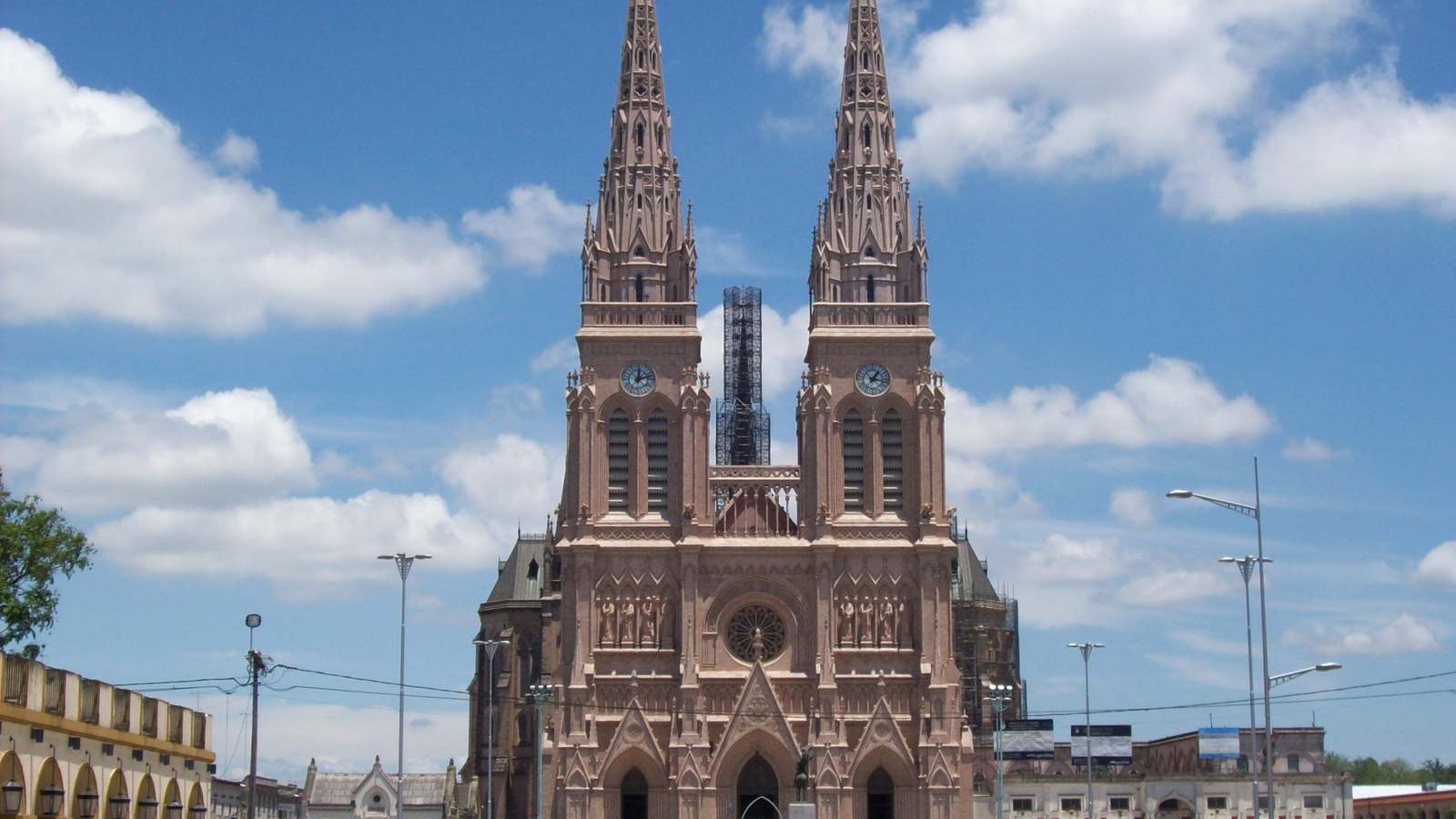 Twin Gothic spires of the Basilica of Our Lady of Luján under a blue sky