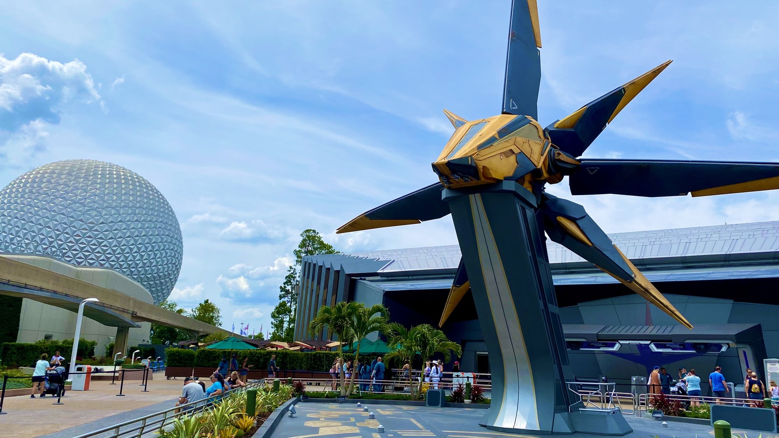 Guardians of the Galaxy: Cosmic Rewind pavilion entrance with the Starblaster ship and EPCOT Spaceship Earth nearby