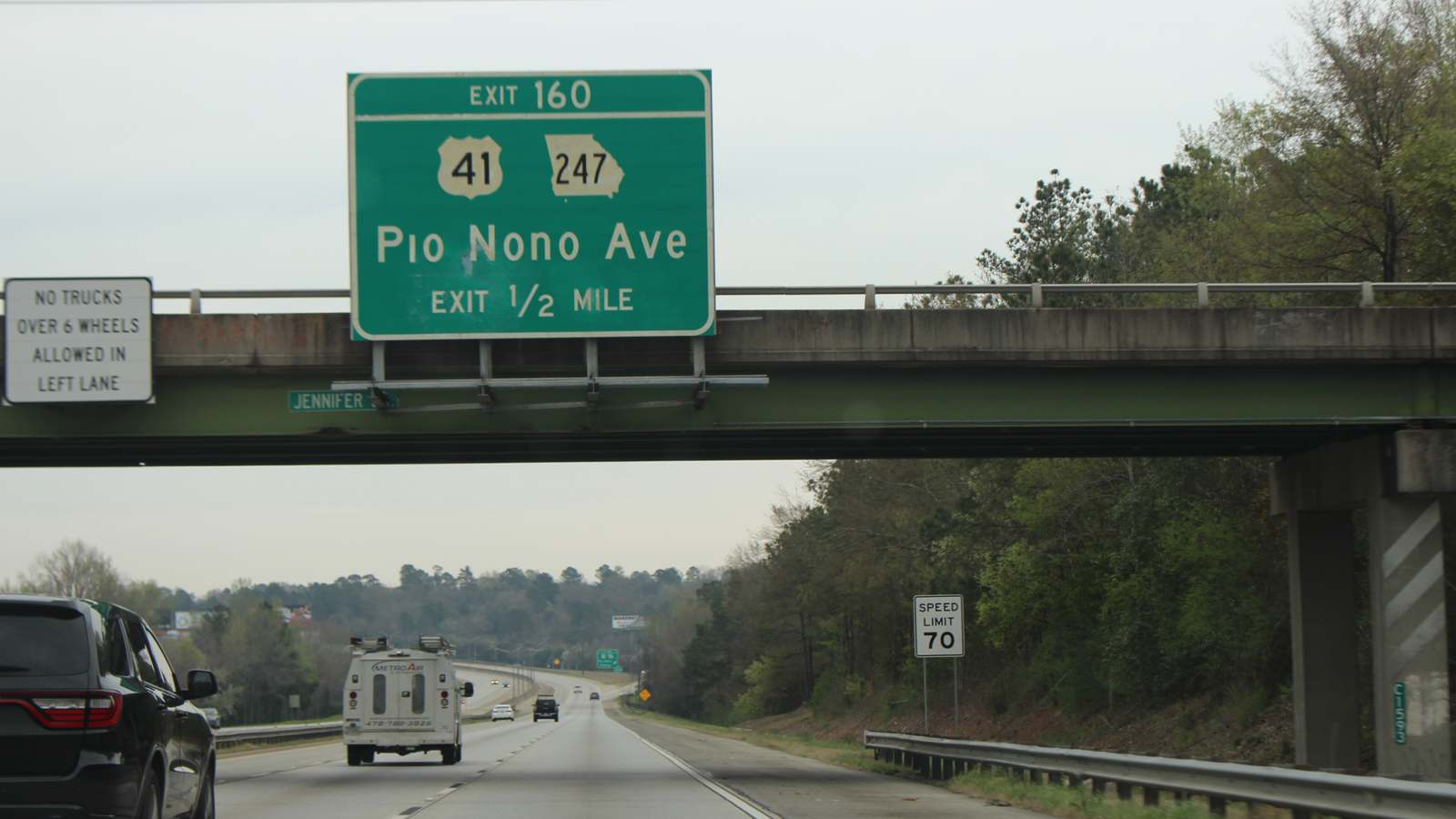 Interstate 75 in Georgia with an overhead green sign for Exit 160 to US 41 and Pio Nono Avenue, and traffic heading north.