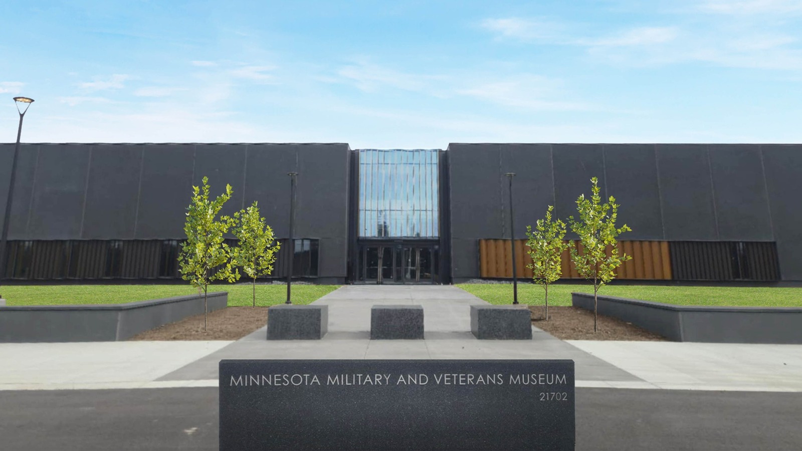 New Minnesota Military and Veterans Museum entrance with museum name and21702streetnumber on the foreground sign