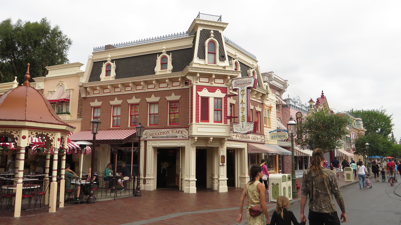 Carnation Cafe and Main Street U.S.A. at Disneyland Park in Anaheim, California, with Sleeping Beauty Castle in the distance