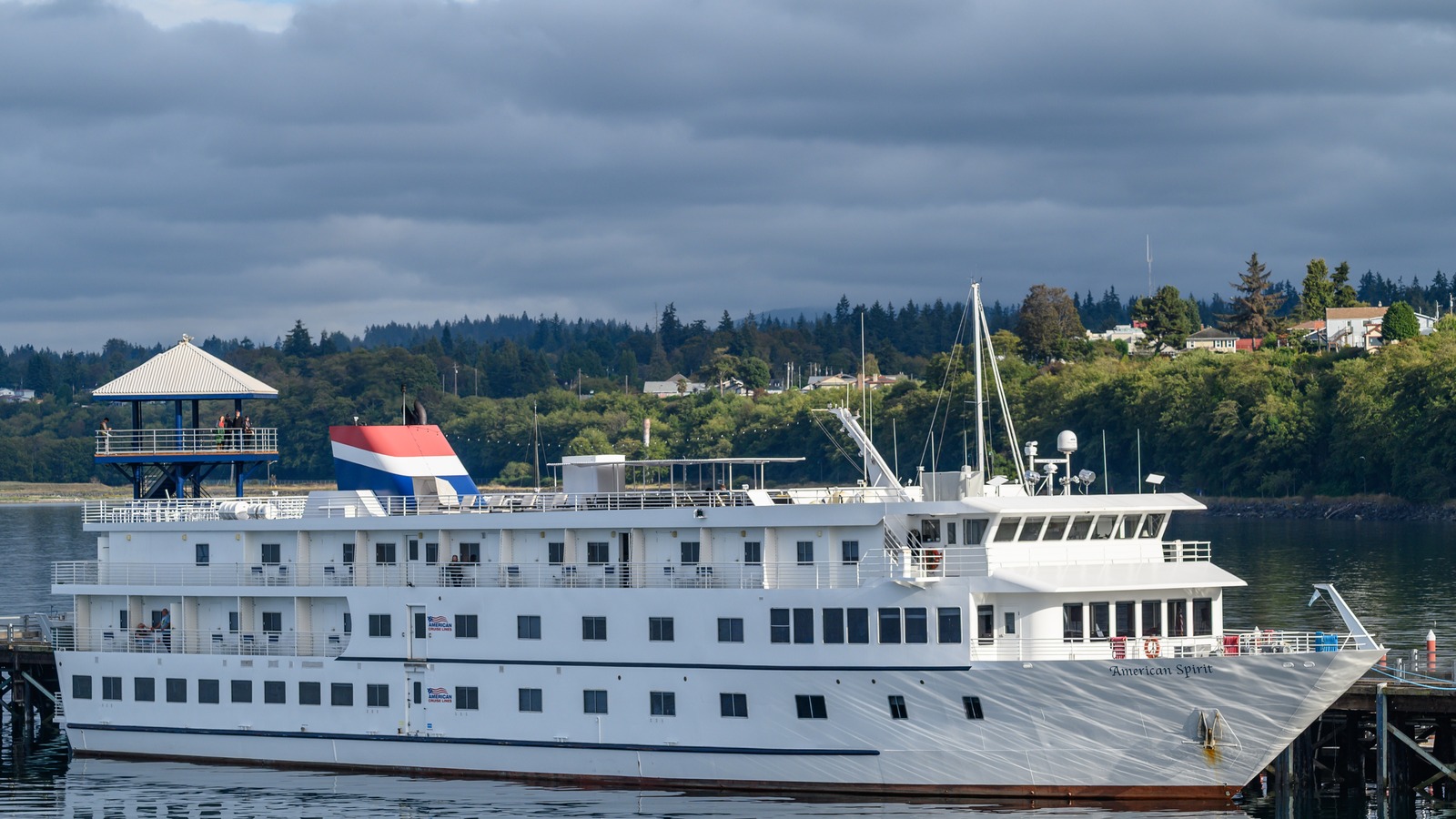 American Spirit, an American Cruise Lines small ship, docked at a wooden pier in Port Angeles, Washington