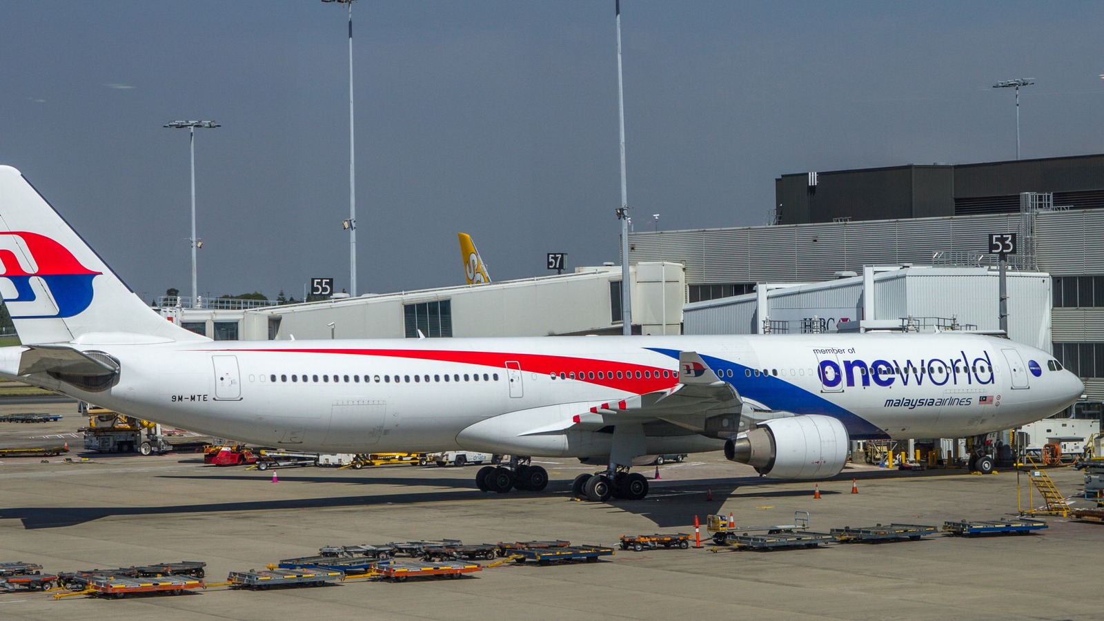 Malaysia Airlines Airbus A330 9M-MTE in oneworld livery parked at a Sydney Airport gate