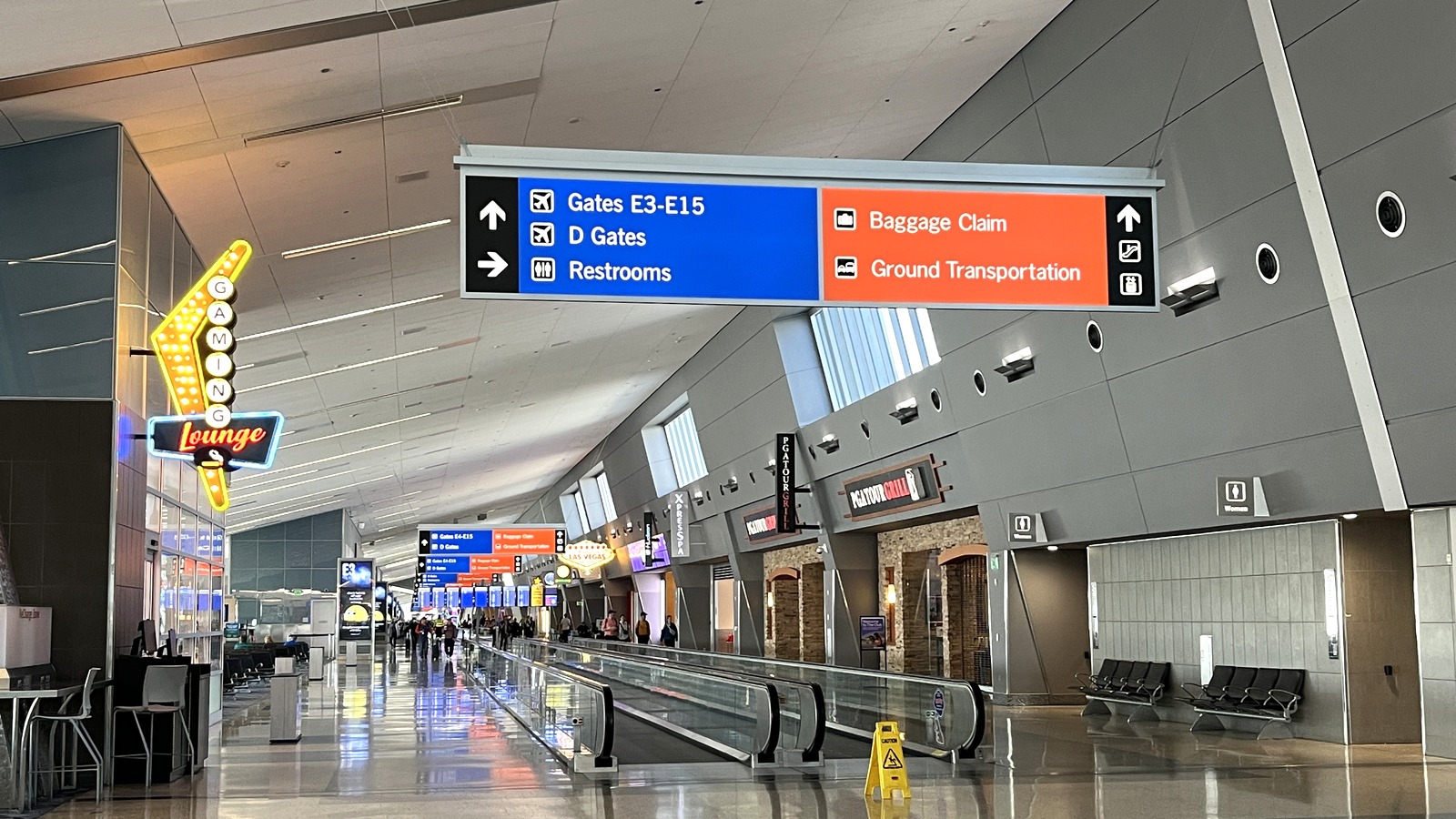 Harry Reid International Airport terminal corridor with D Gates and E Gates signs in Las Vegas