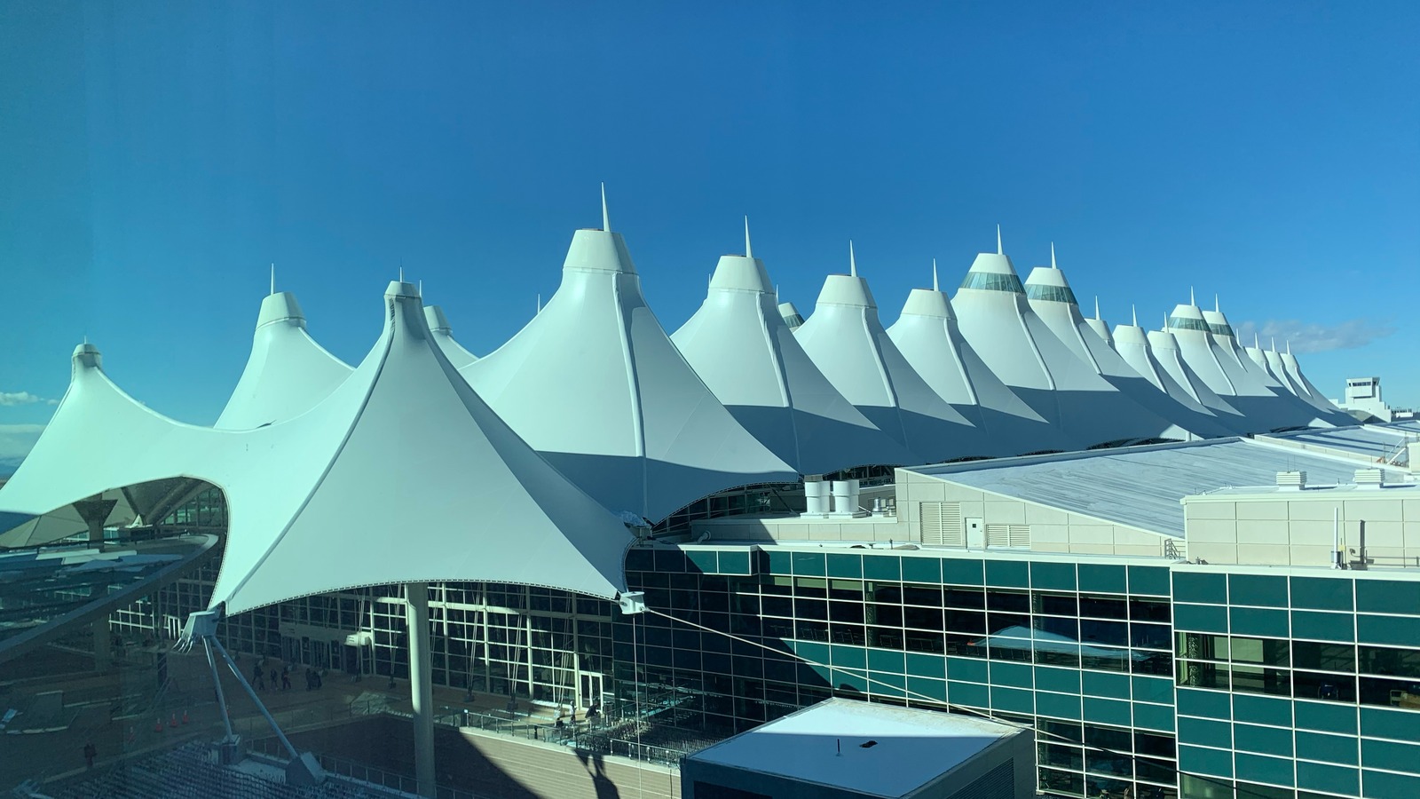 Denver International Airport terminal with its distinctive white tent roof, photographed in February 2021