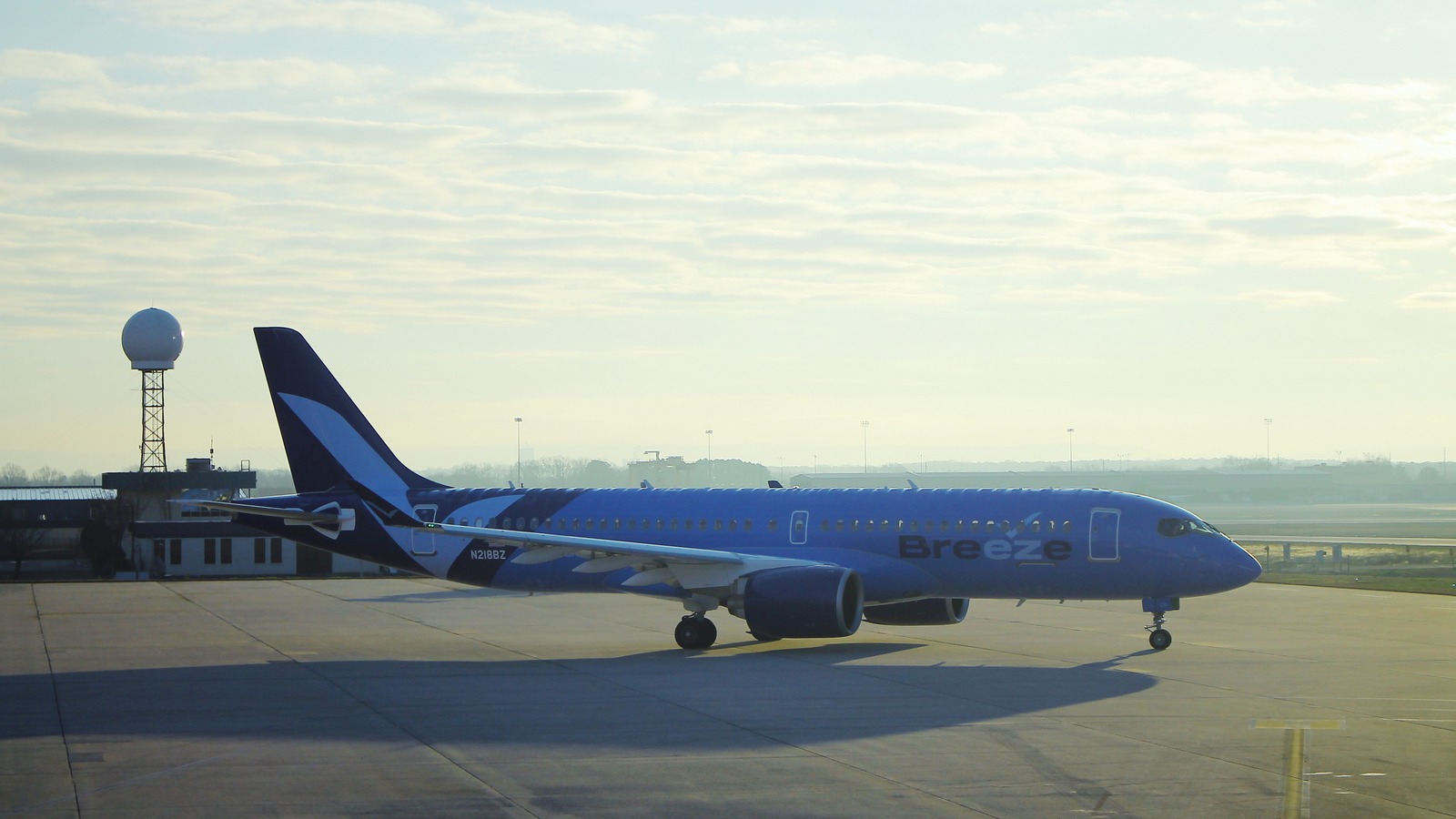 Breeze Airways Airbus A220 N218BZ on an airport tarmac
