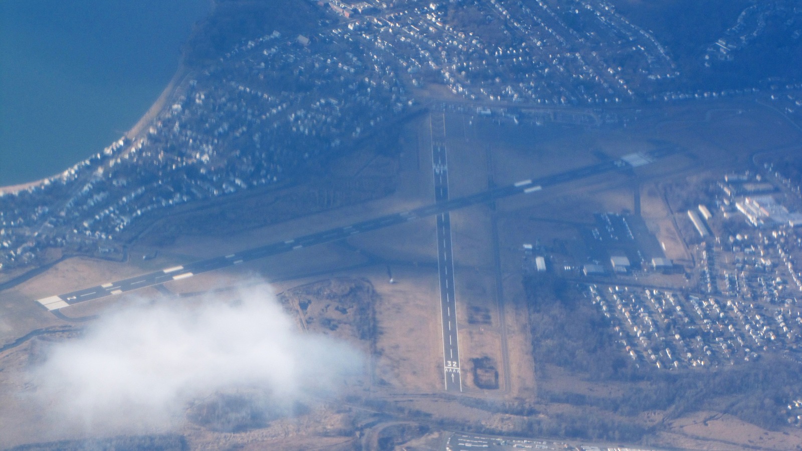 Aerial view of Tweed New Haven Airport runways along the Connecticut shoreline