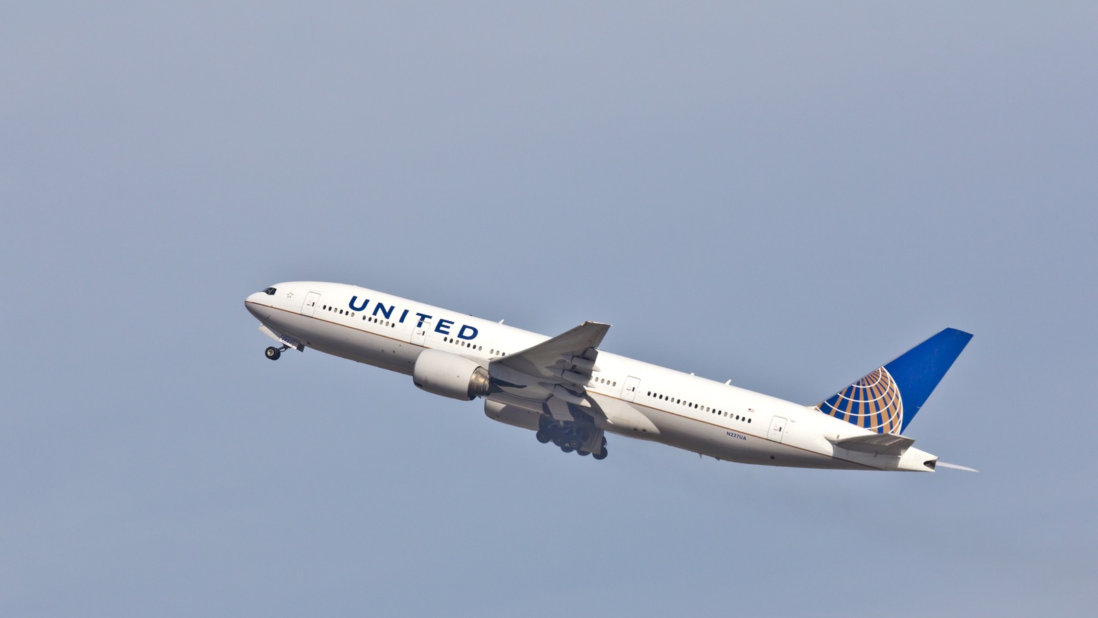 United Airlines Boeing 777 climbing after departure from San Francisco International Airport