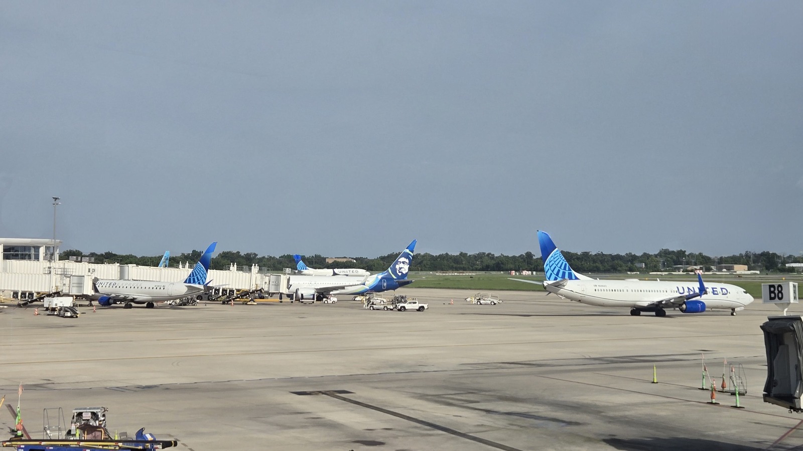Aircraft parked at gates at Louis Armstrong New Orleans International Airport in July 2026