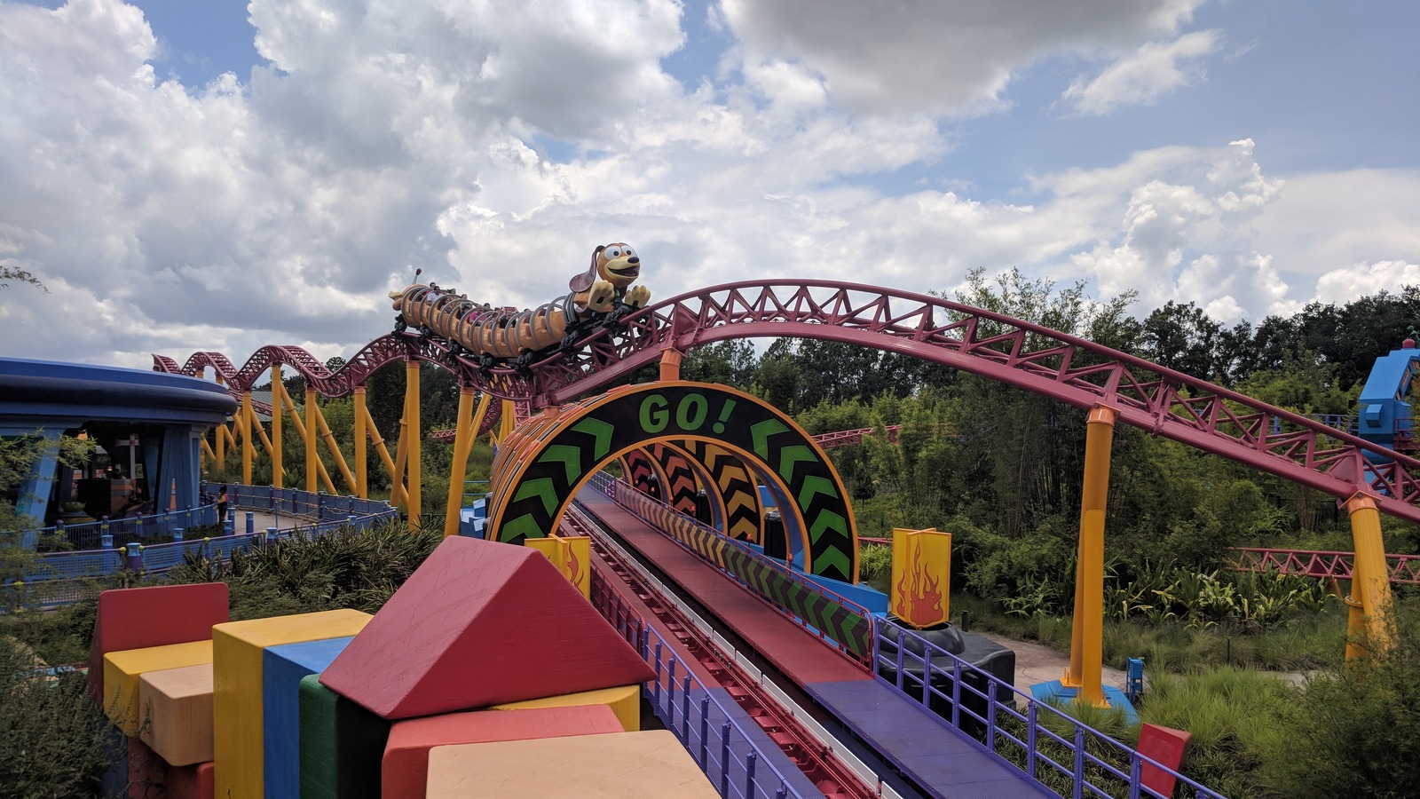 Slinky Dog Dash train on the red and yellow track at Toy Story Land in Disney's Hollywood Studios