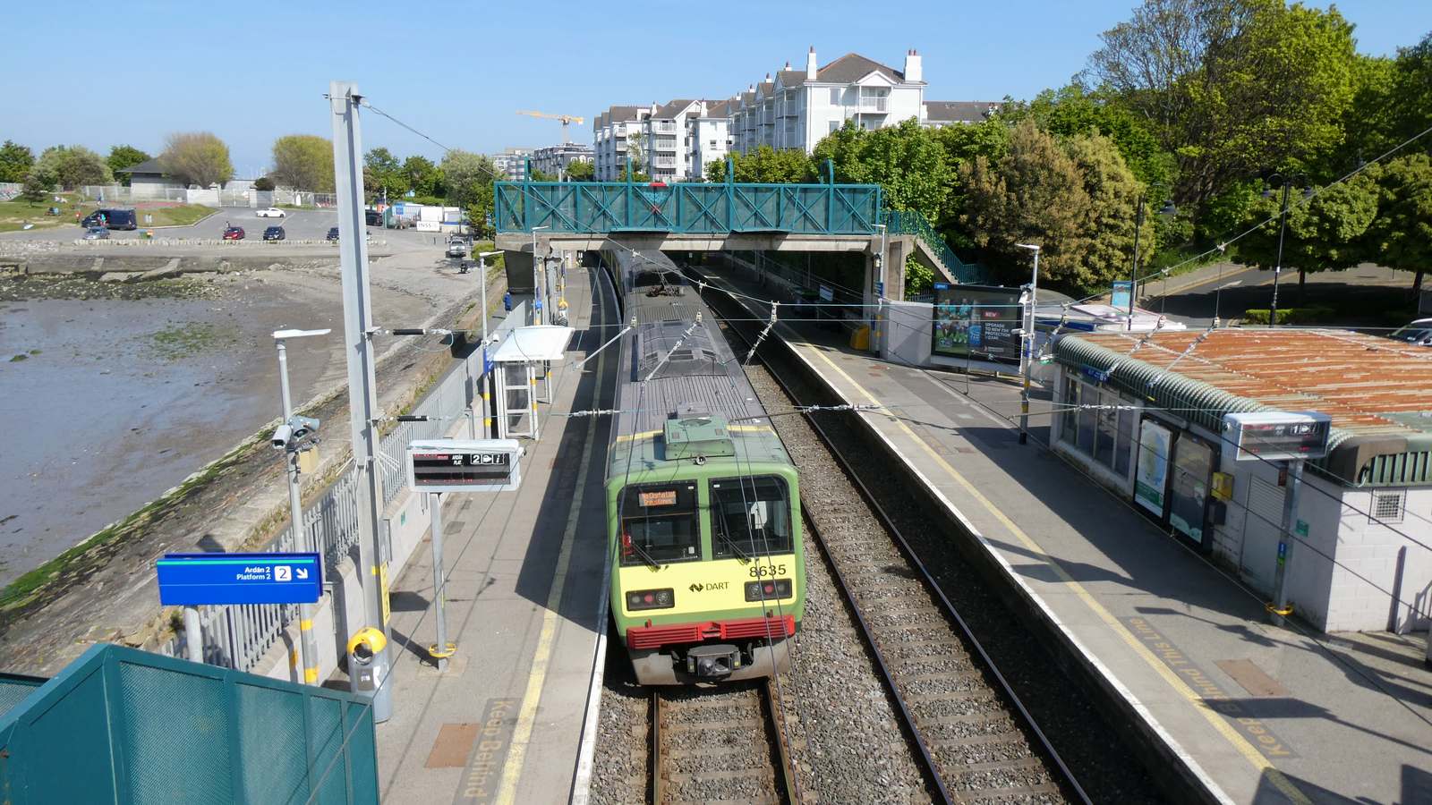 DART train 8635 at Salthill and Monkstown station beside Dublin Bay, seen from the footbridge