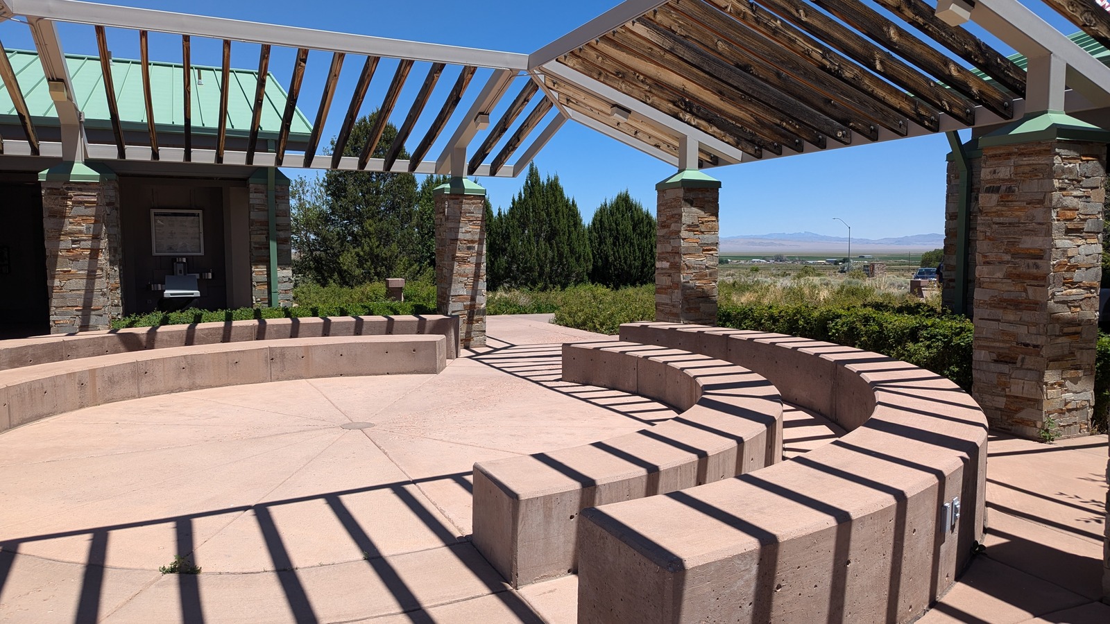 Outdoor seating and shaded courtyard at Great Basin Visitor Center in July 2024