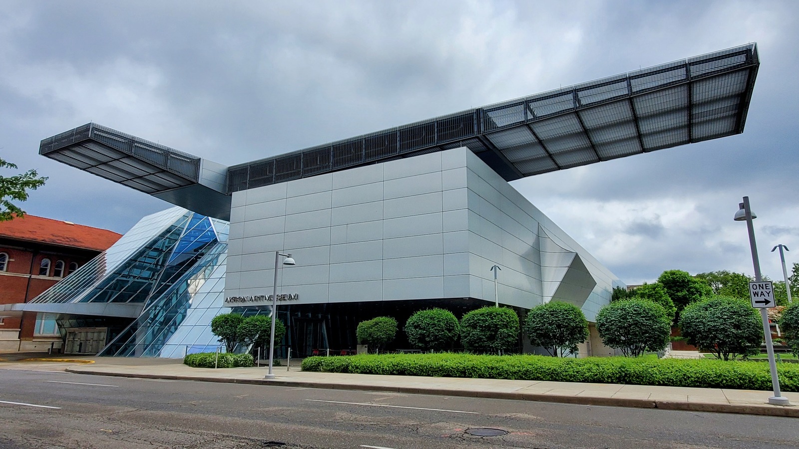 Akron Art Museum exterior photographed in May 2024, with the historic brick building beside its contemporary addition