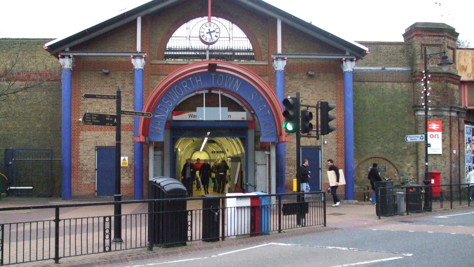 Street-level brick entrance to Wandsworth Town station on Old York Road, with the station name in an arch over the doorway.