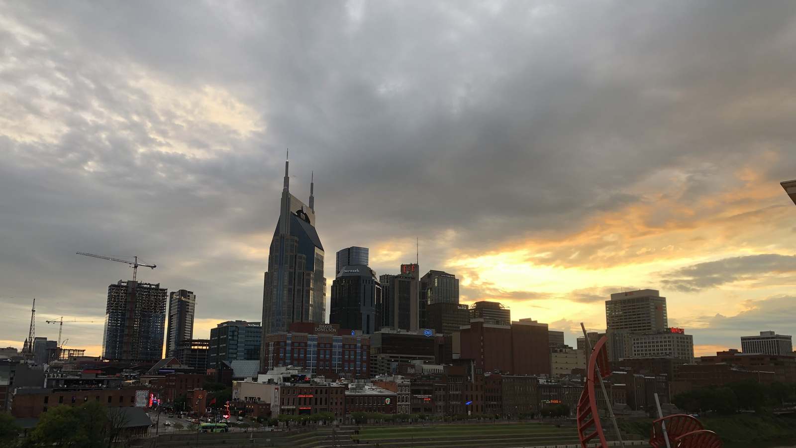 Downtown Nashville skyline and Lower Broadway at sunset from across the Cumberland River