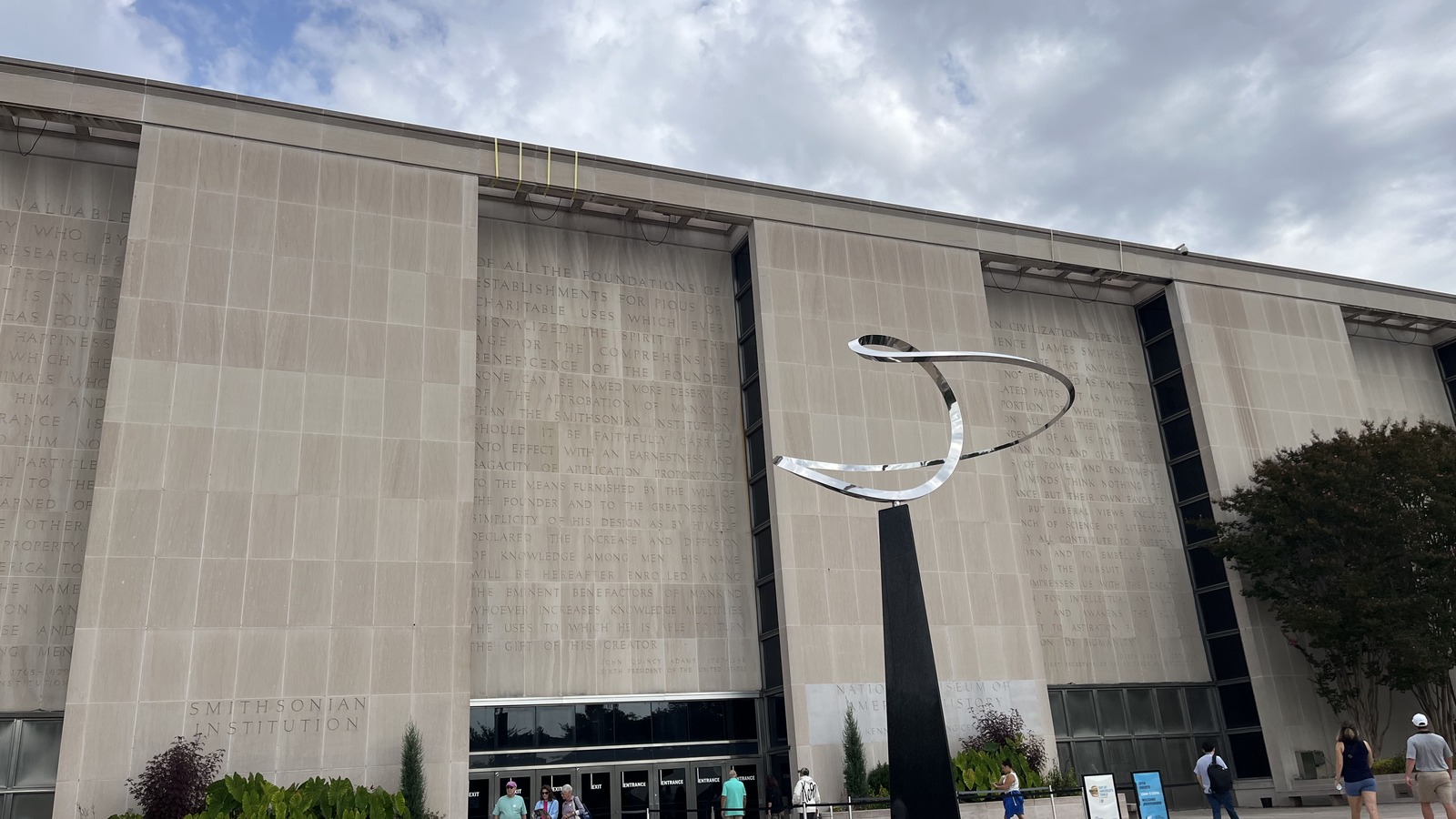 National Museum of American History exterior with its stone facade, entrance and foreground sculpture, photographed in September 2025