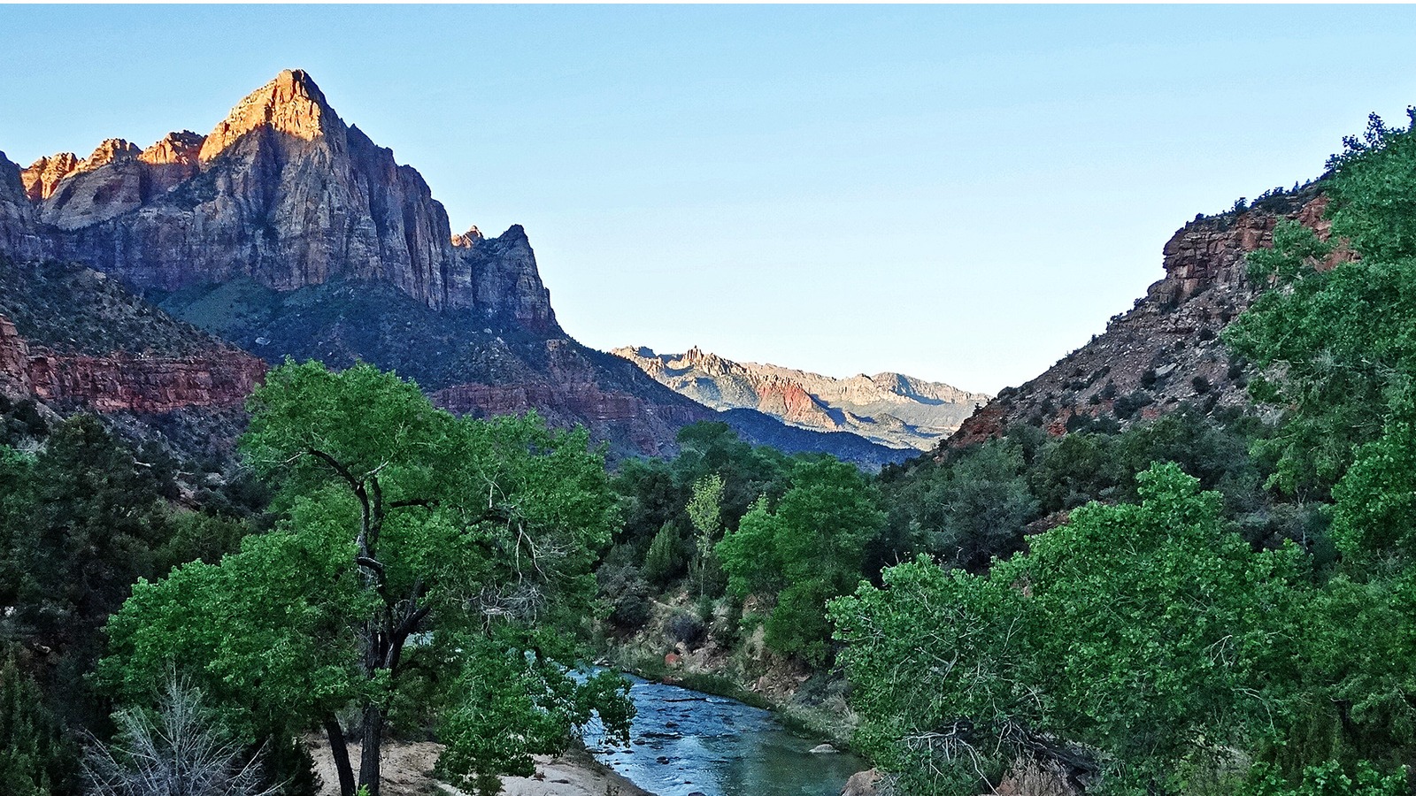 The Watchman rising over the Virgin River at Canyon Junction in Zion National Park, the south entrance approach to Zion Canyon Scenic Drive.