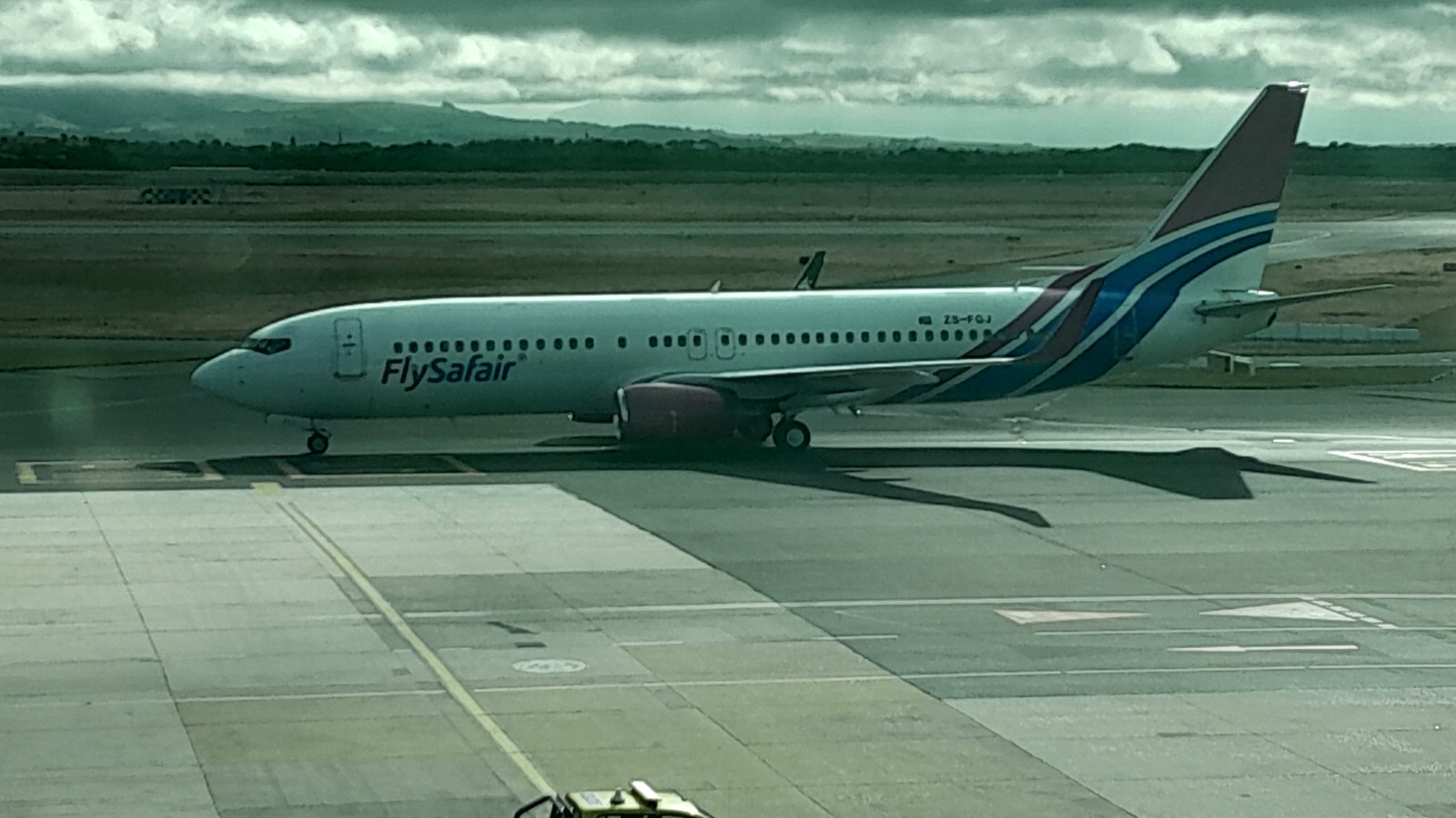 FlySafair Boeing 737 aircraft ZS-FGJ on an airport apron in December 2024