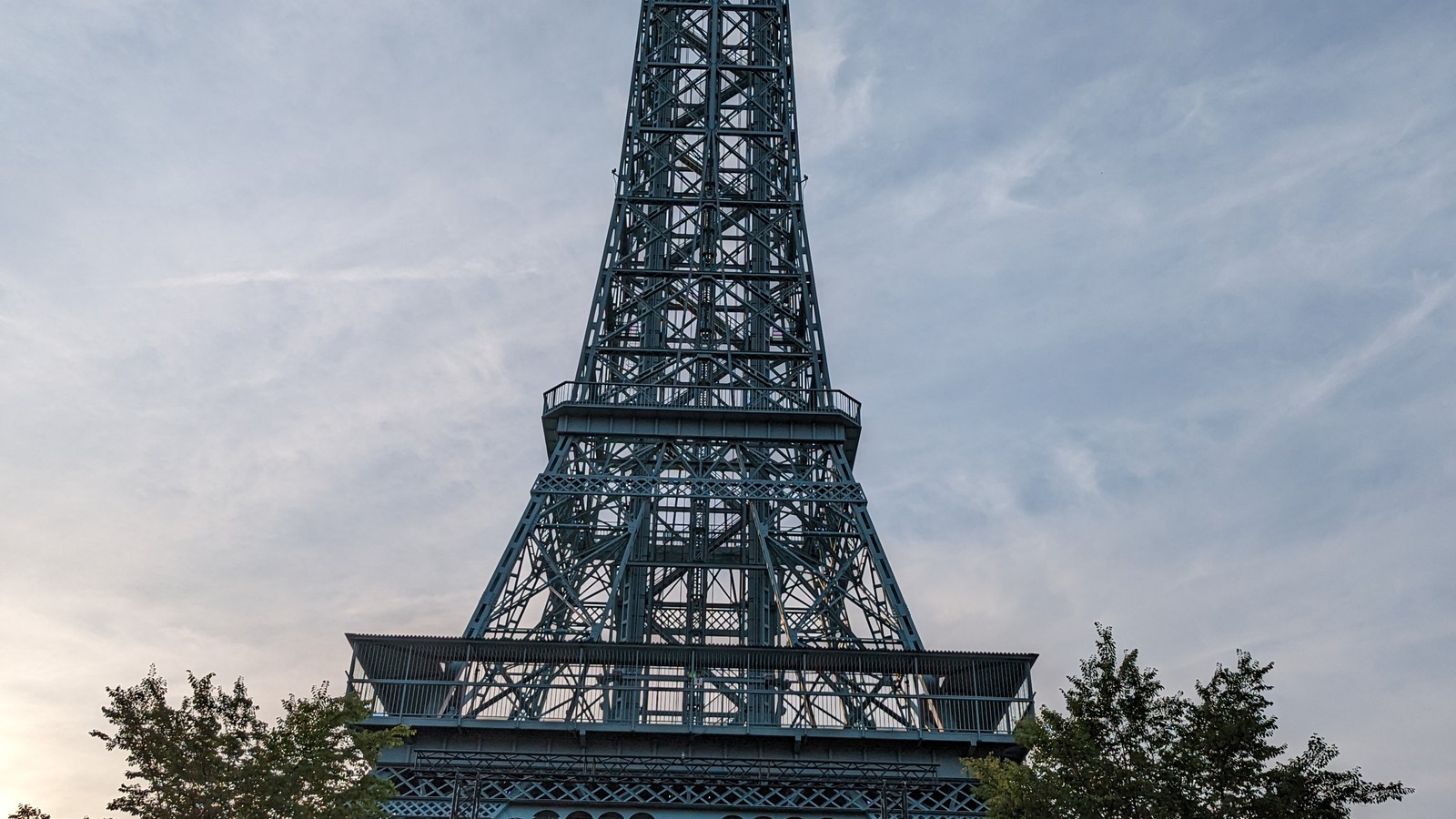Kings Island Eiffel Tower rising above trees near International Street