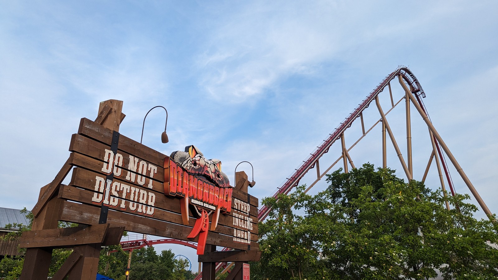 Diamondback entrance sign and red coaster lift hill at Kings Island