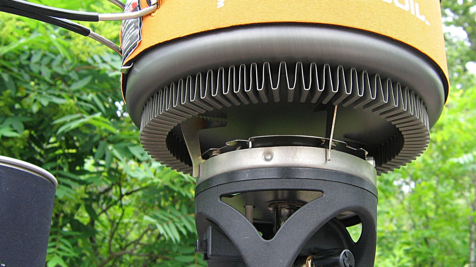 Jetboil camping stove with its cooking pot and heat exchanger viewed from below.