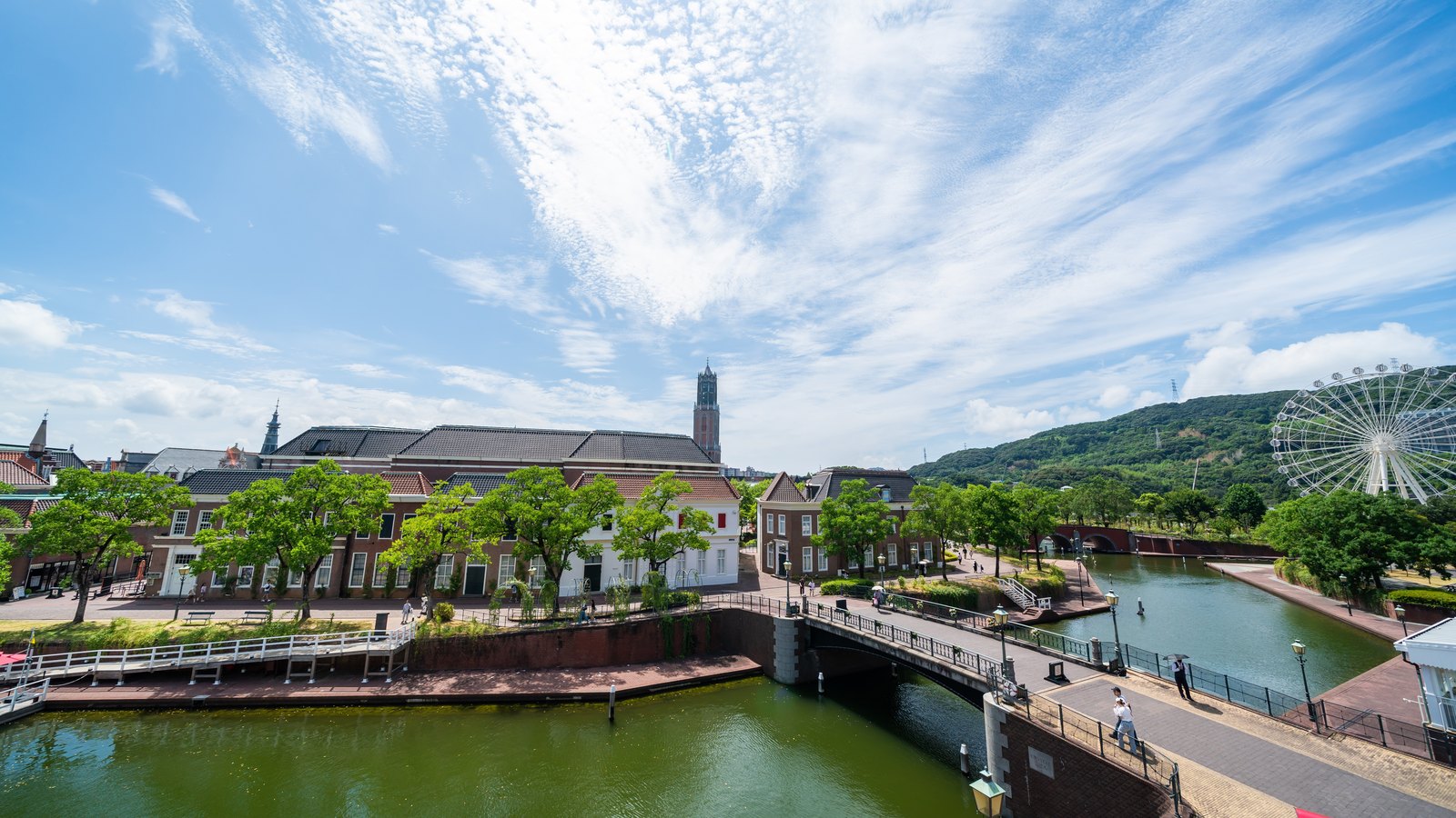 Canal bridges, Dutch style buildings and the White Ferris Wheel at Huis Ten Bosch
