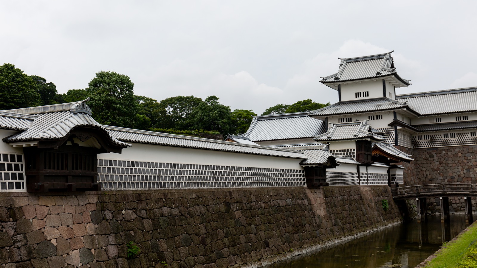 White reconstructed turrets and stone walls at Kanazawa Castle