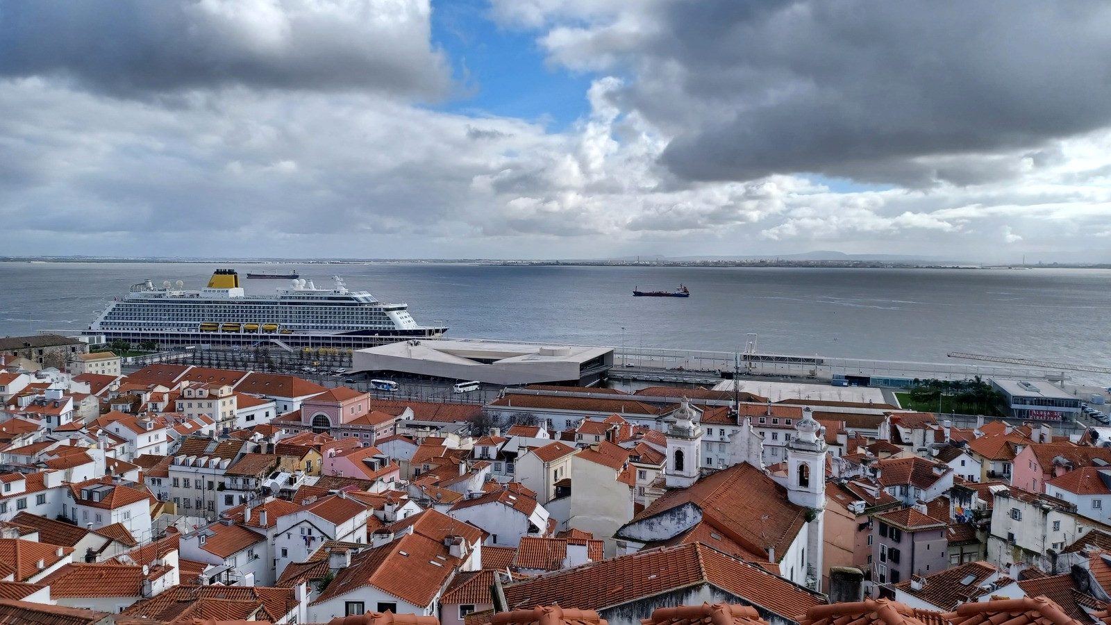 Cruise ship at Lisbon seen above the Alfama rooftops