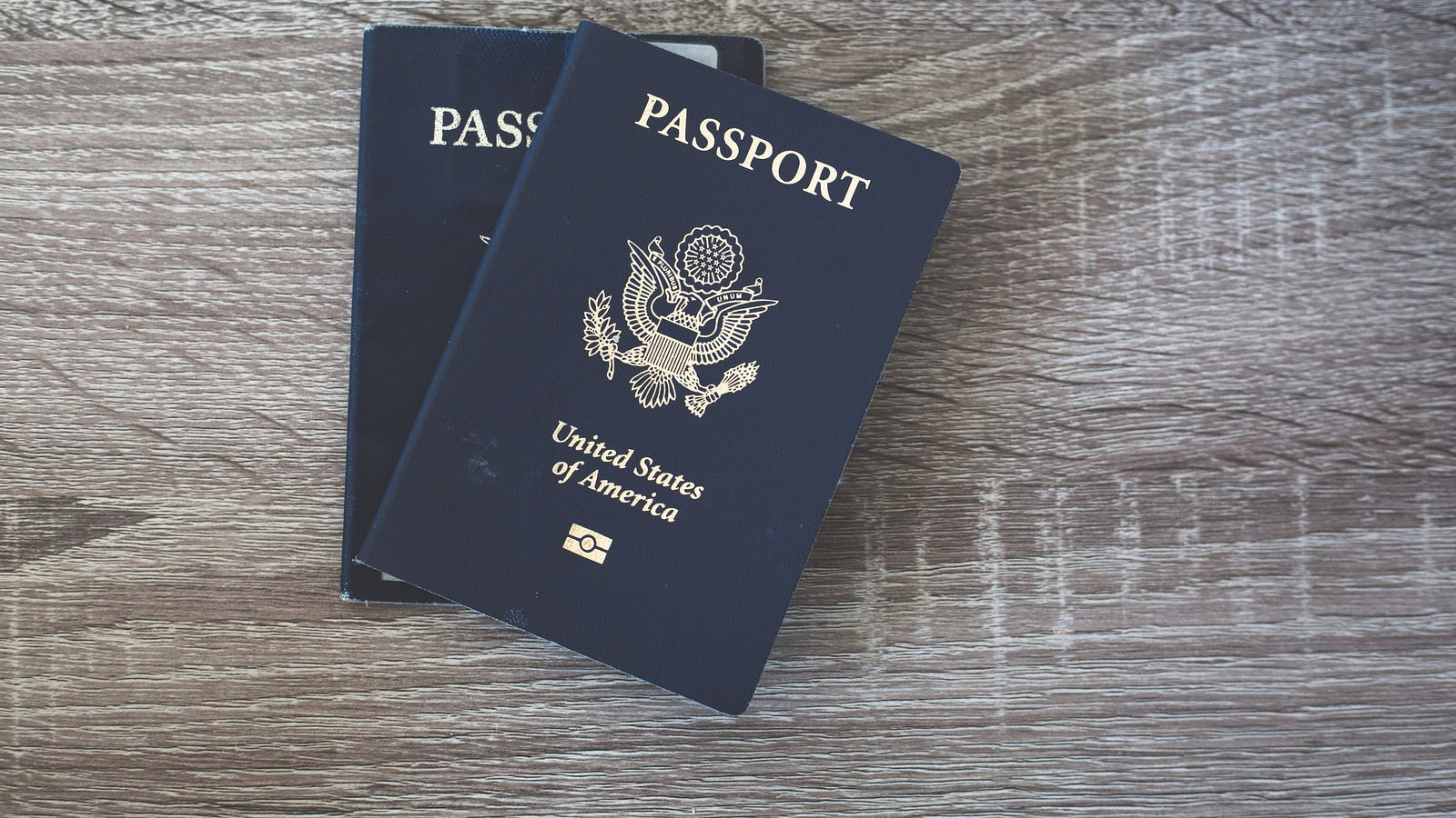 Passports arranged on a table before international travel