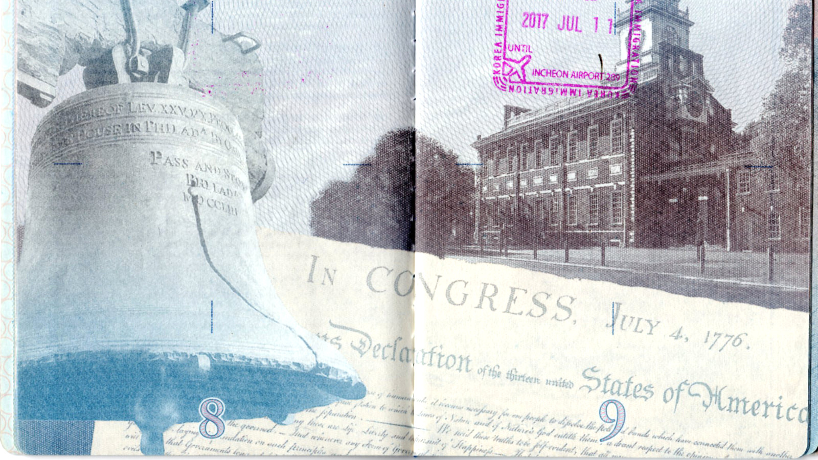 Open United States passport showing a blank page beside a stamped and visa page