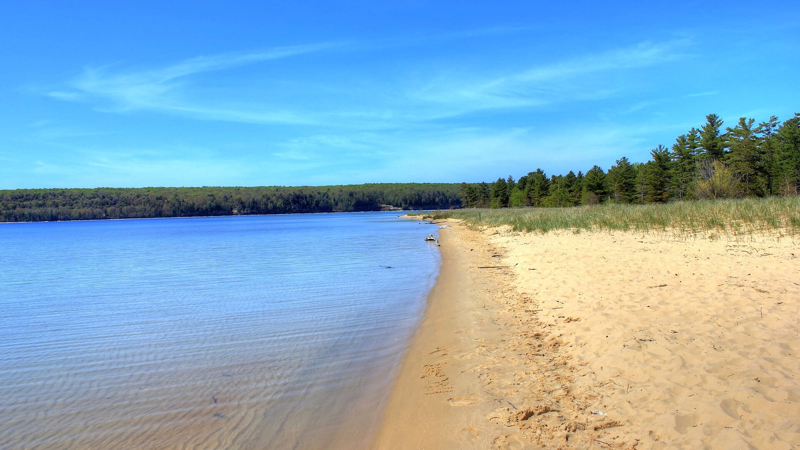 Sand dunes and blue water at Sleeping Bear Dunes in Michigan