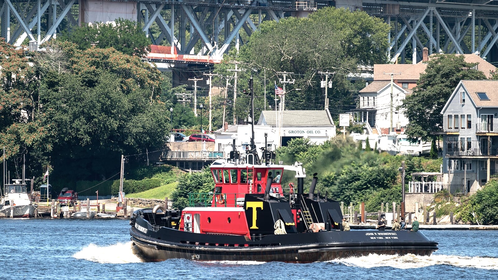 Working boats on the Thames River beside New London