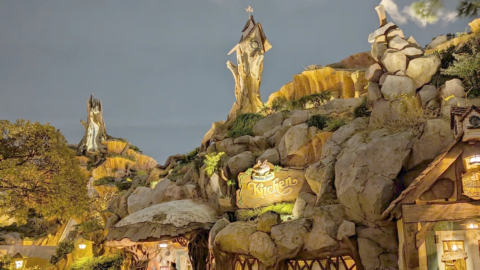 Grandma Sara's Kitchen and illuminated rockwork in Critter Country at Tokyo Disneyland