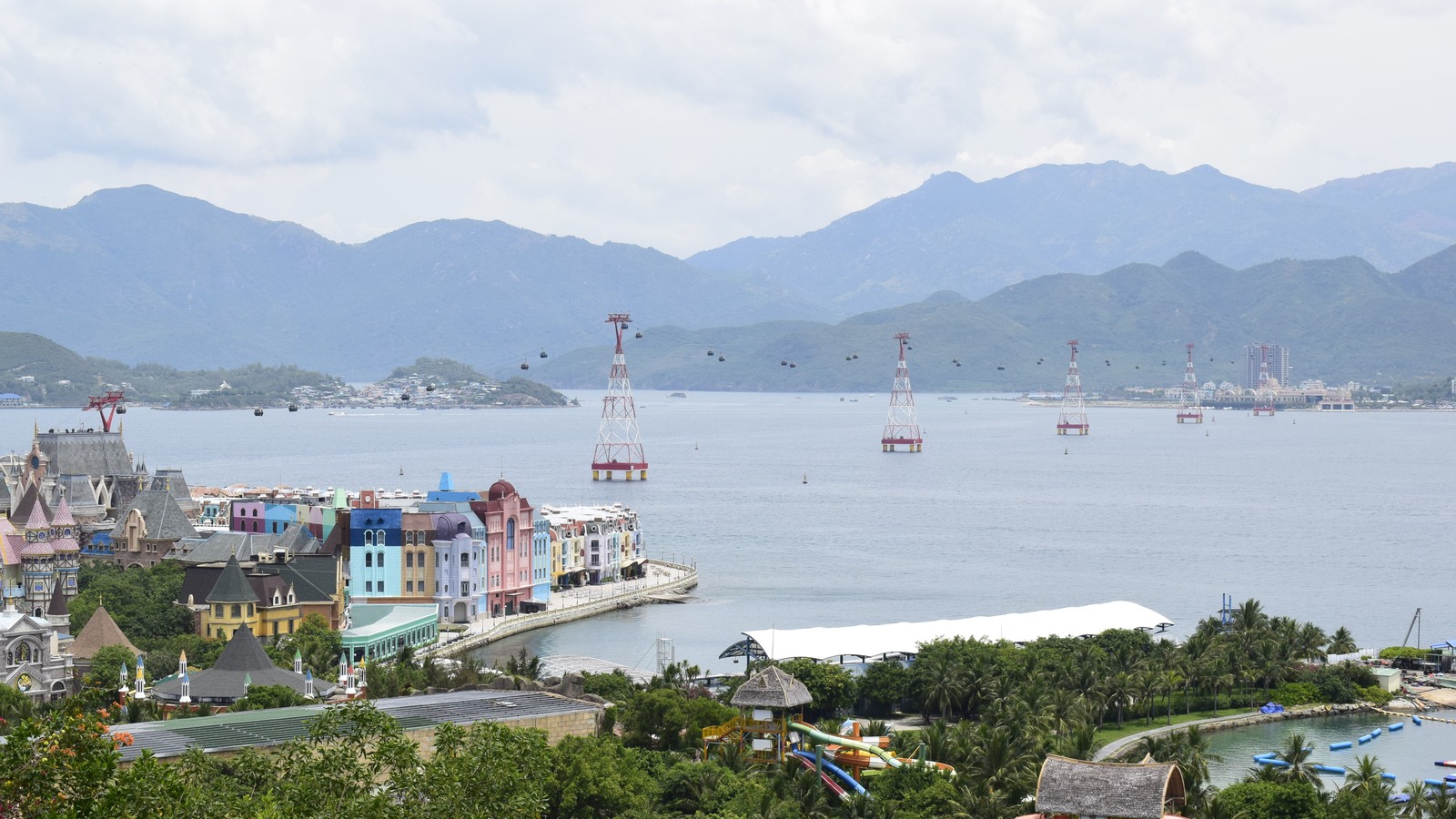 VinWonders Nha Trang bay with cable cars, waterfront buildings and water slides