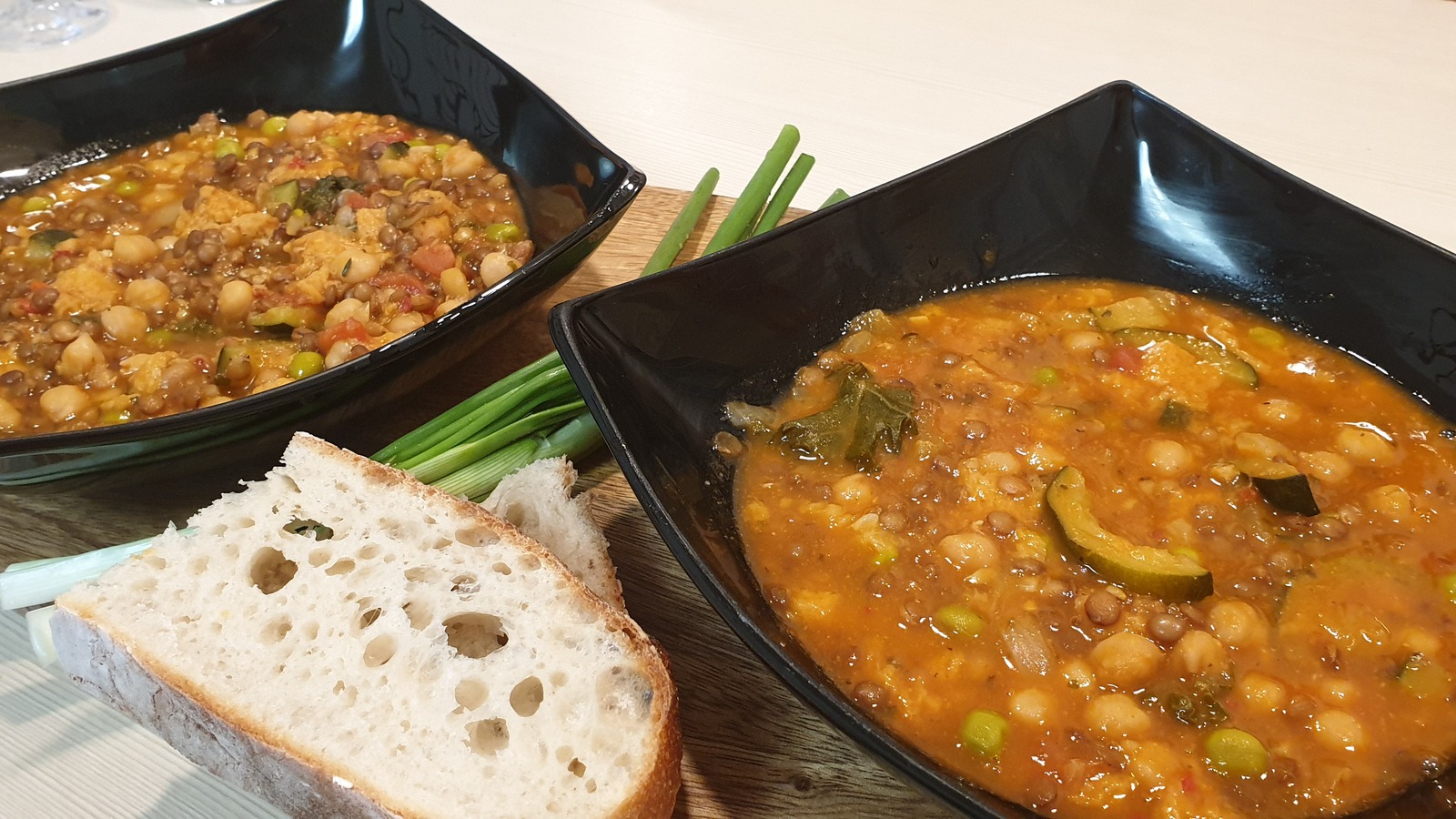 Bowls of Tuscan ribollita with bread