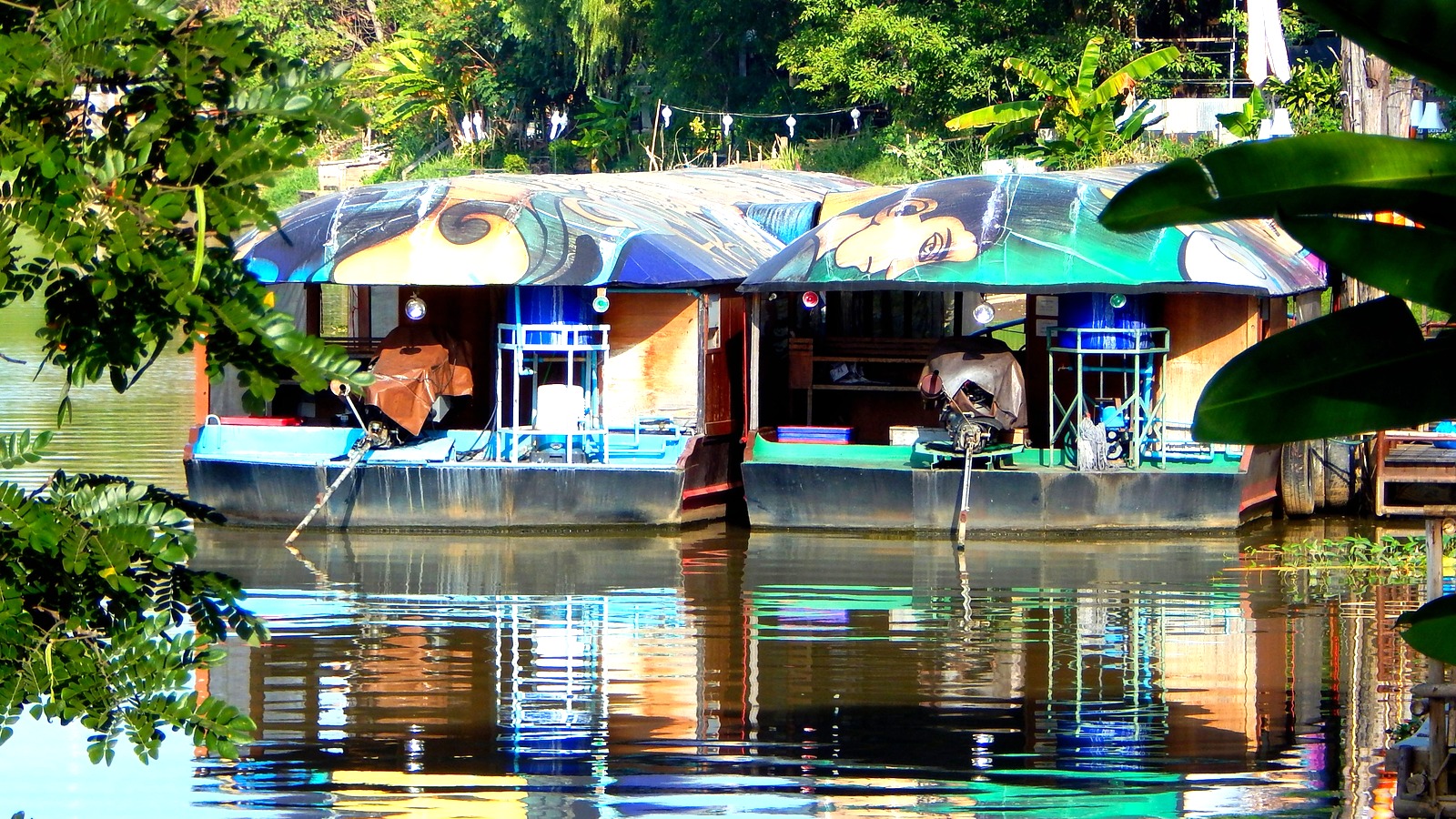 Colorful restaurant boats on the Ping River in Chiang Mai