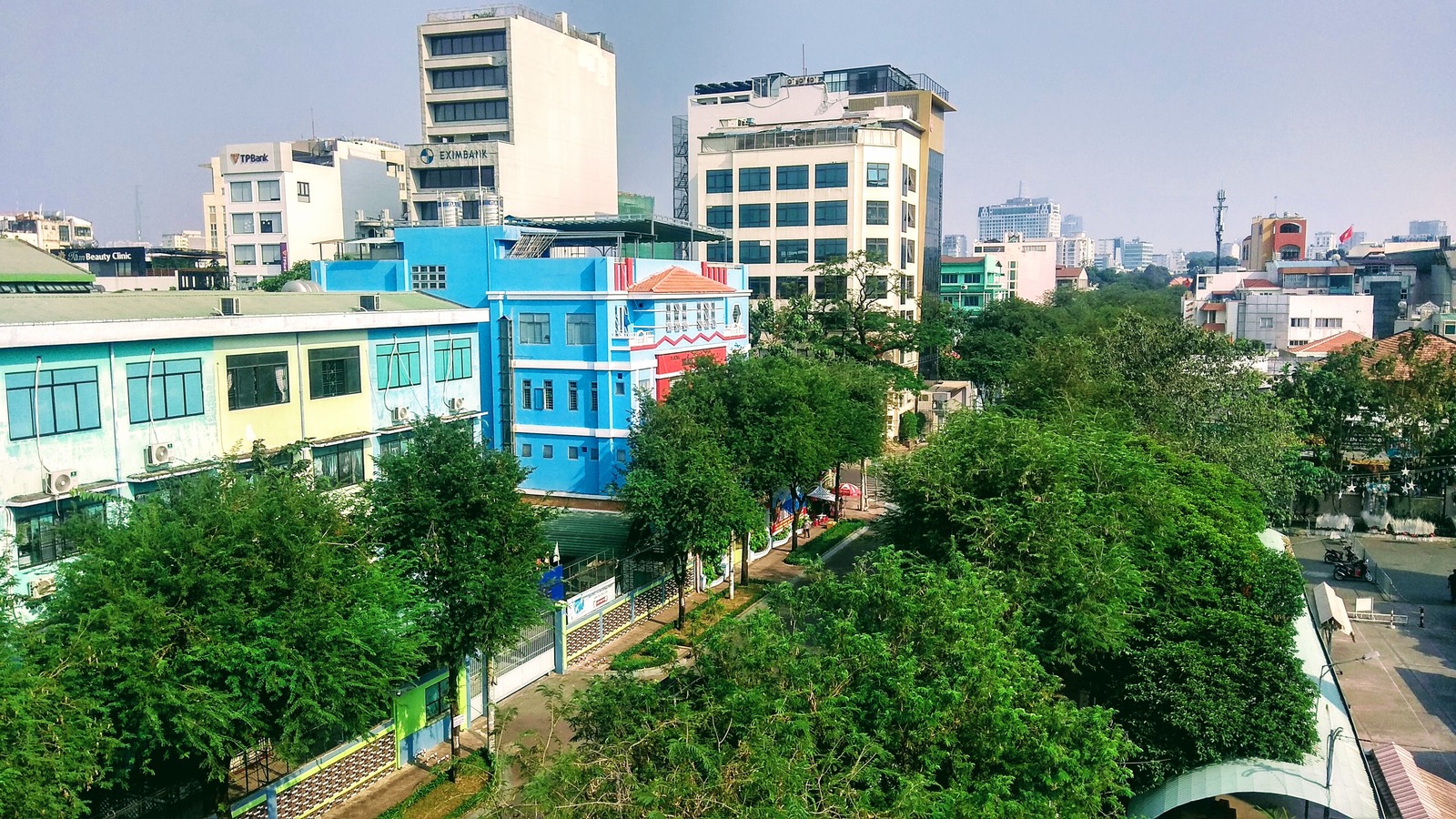 Bright tree lined street in District 3 Ho Chi Minh City