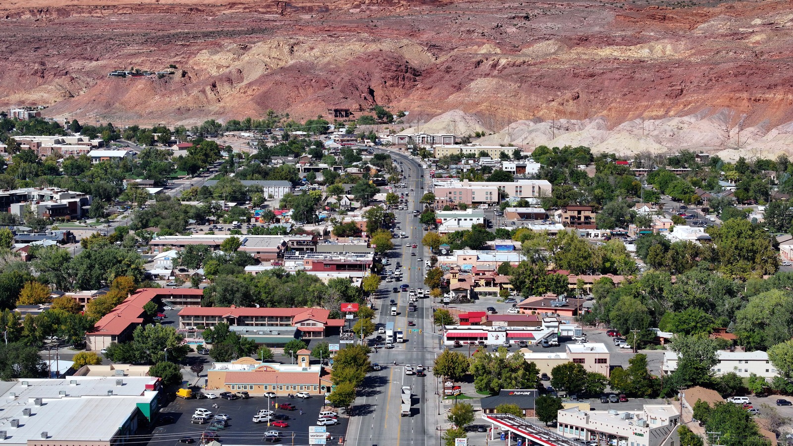 Main Street in Moab with red rock cliffs in the distance