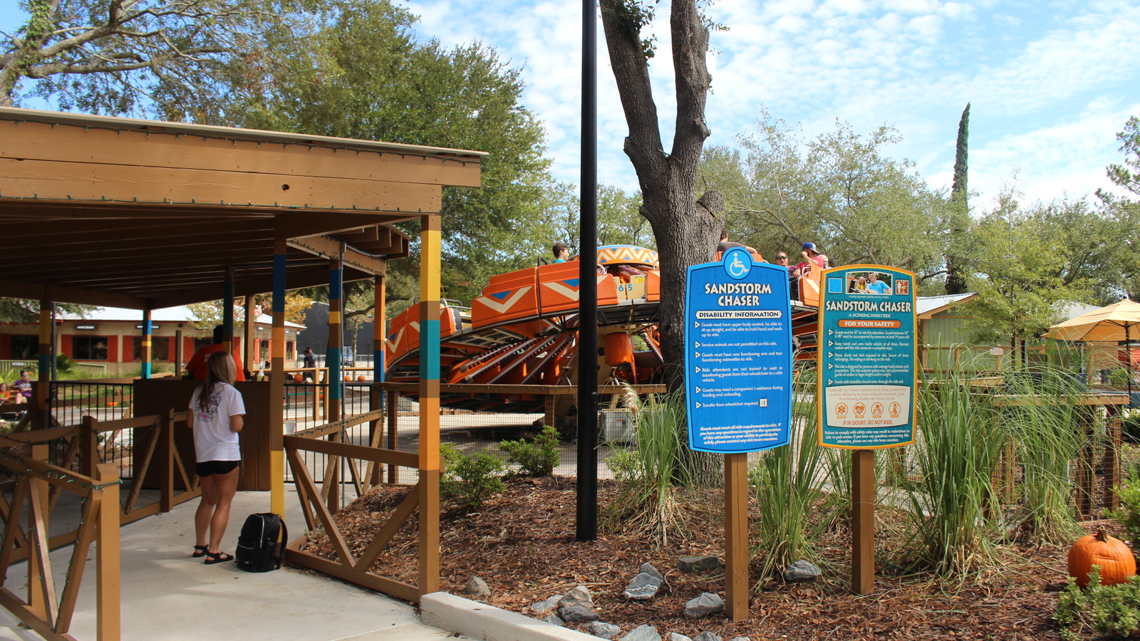 Sandstorm Chaser ride and accessibility sign at Wild Adventures