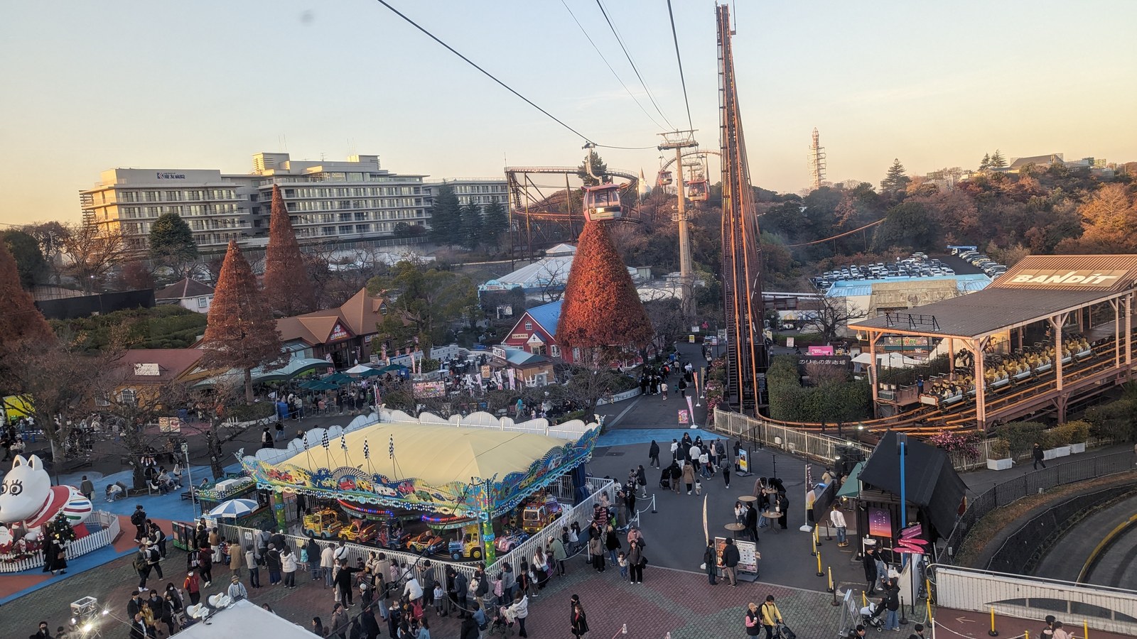 Yomiuriland ride area with a carousel, coaster structures and the Bandit area