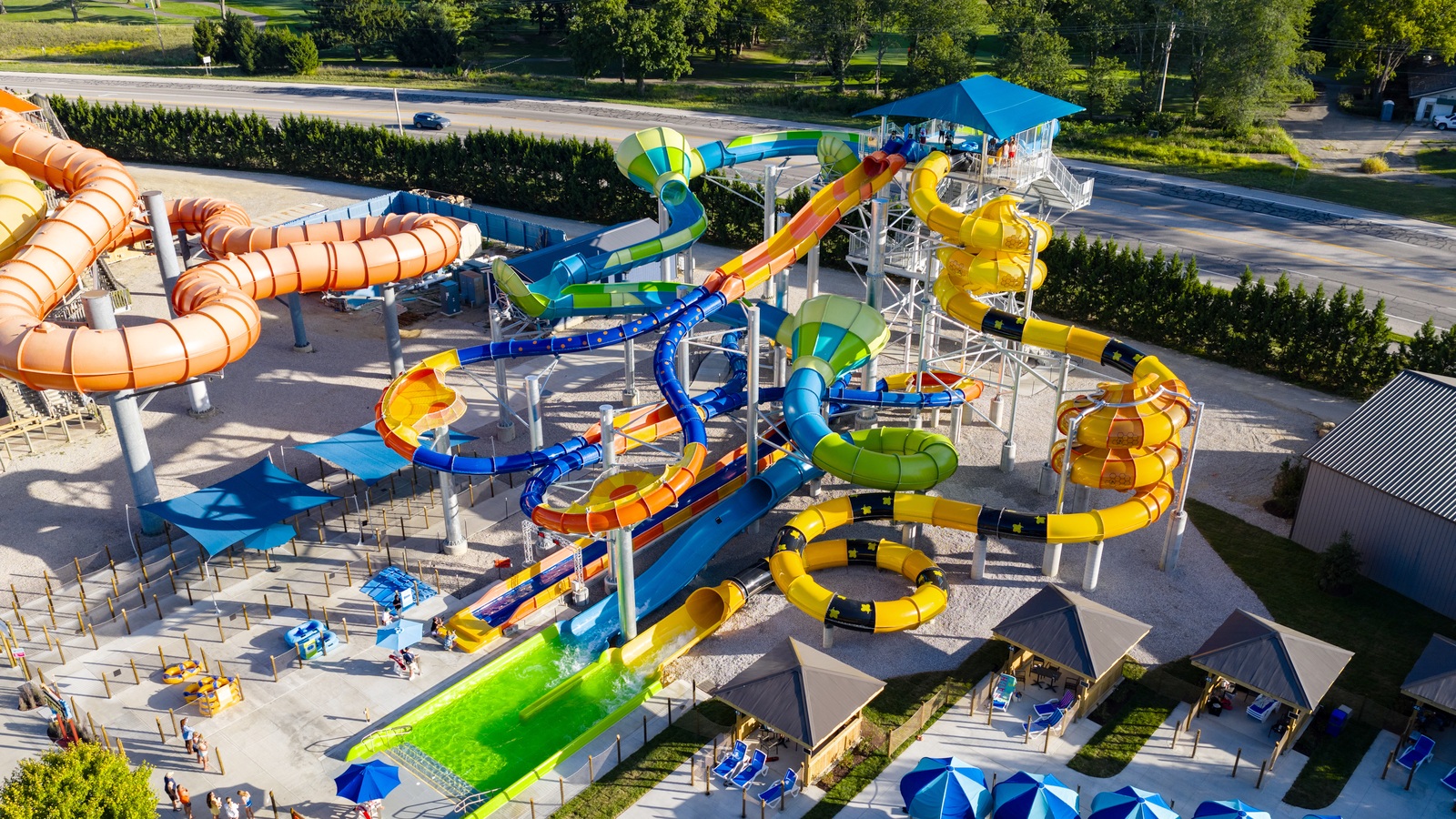Aerial view of Conservation Tower’s colorful slides and blue-roofed platform at Zoombezi Bay