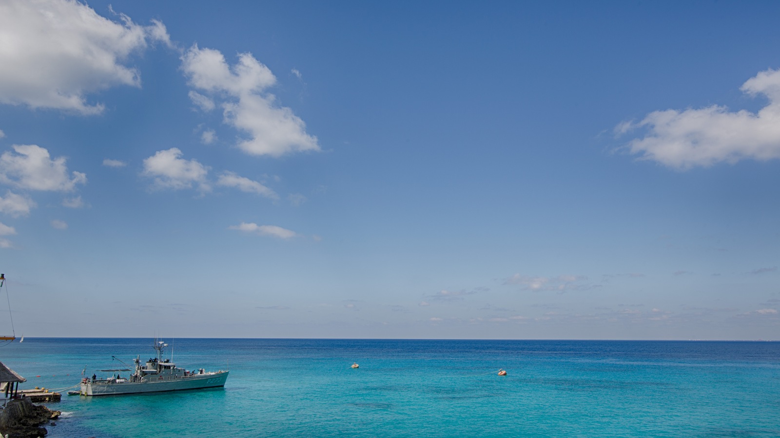 Clear Caribbean water and a small boat off the Cozumel waterfront