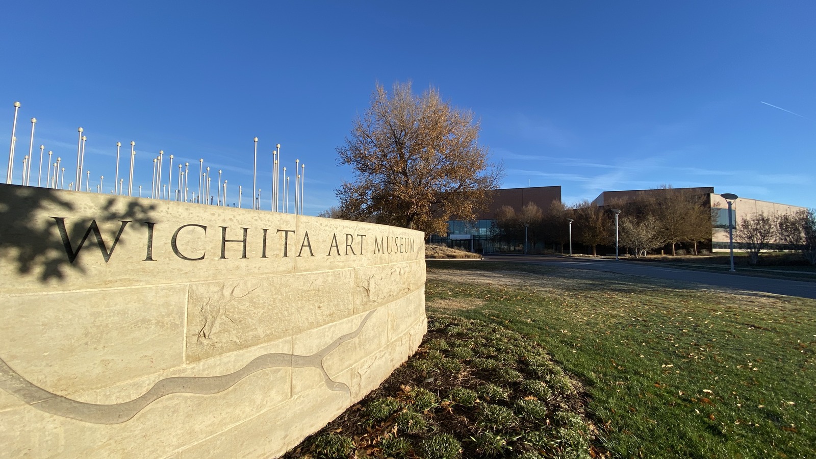 Wichita Art Museum entrance sign and building in Wichita, Kansas, photographed in November 2023
