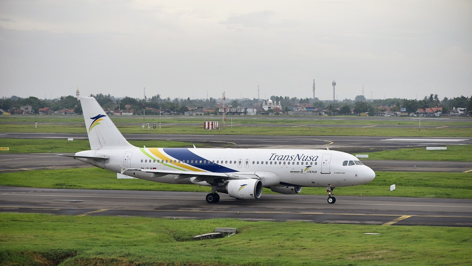 TransNusa Airbus A320 taxiing at Soekarno-Hatta International Airport in Jakarta