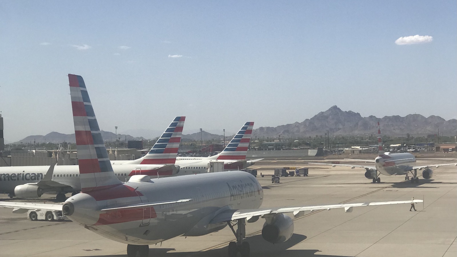 American Airlines jets parked at Phoenix Sky Harbor Airport on a clear day